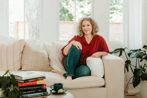 Maggie sitting on a couch