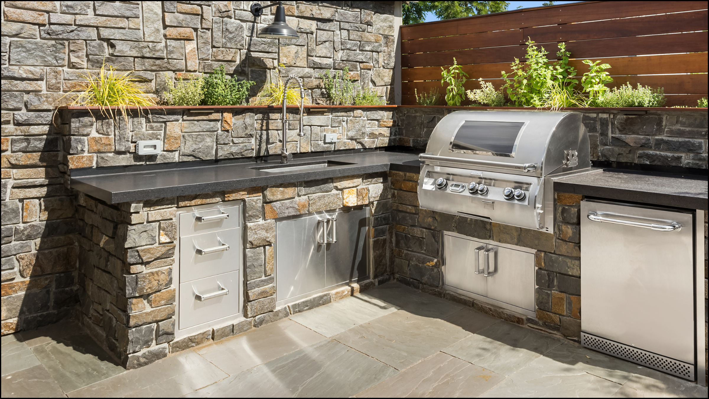 A custom outdoor kitchen installation transforms your backyard into a gathering space for family and friends, making it easy to cook, dine, and spend quality time together in the safety and comfort of your own home.