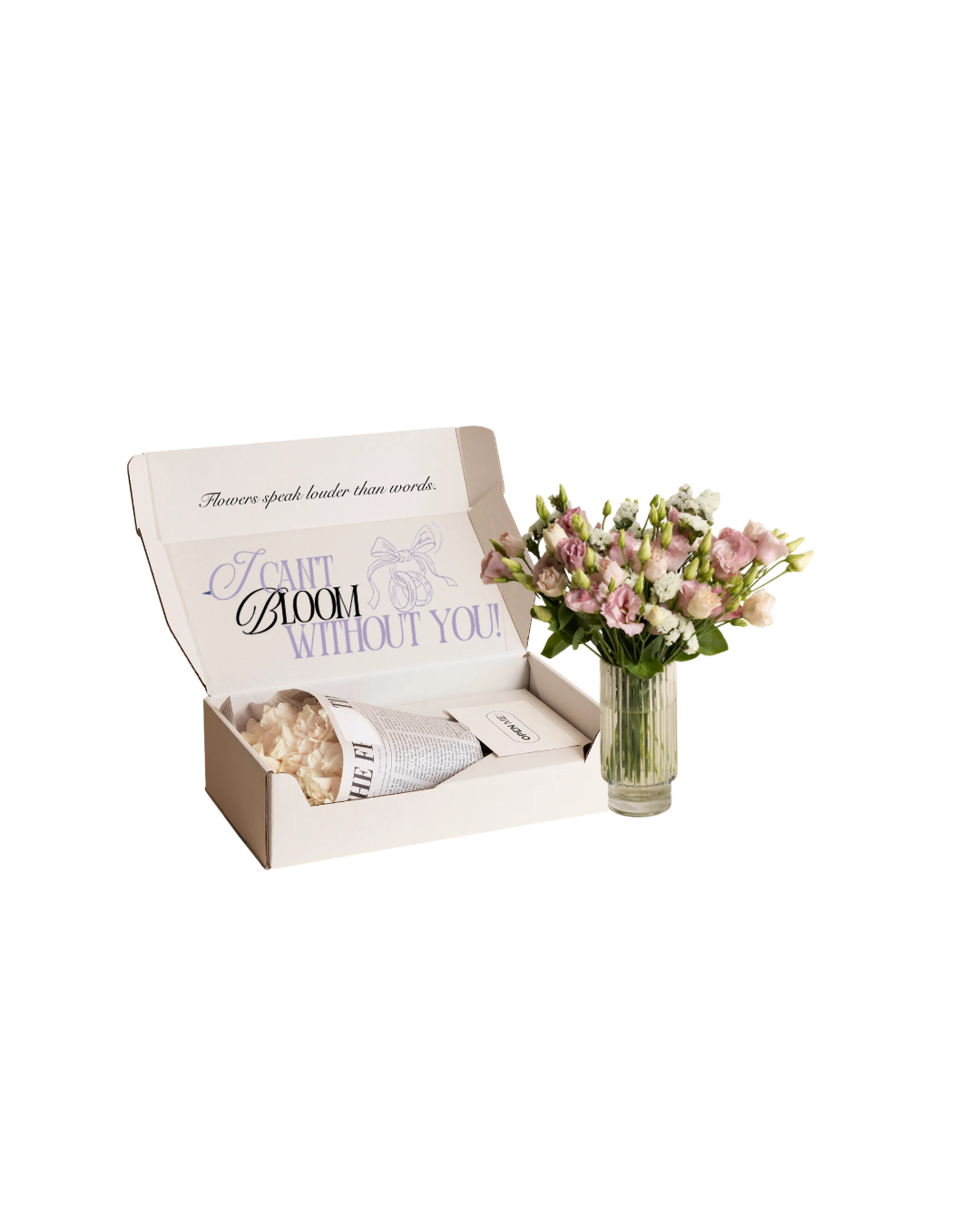 A gift box of pink and white flowers with an open box and a separate glass vase with a bouquet of pink and white flowers next to it.
