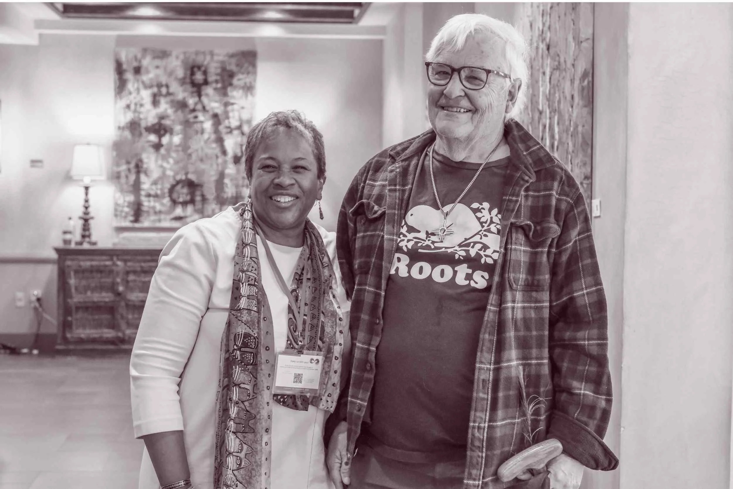  Two attendees smiling together during a Connect to Empower spiritual community event 