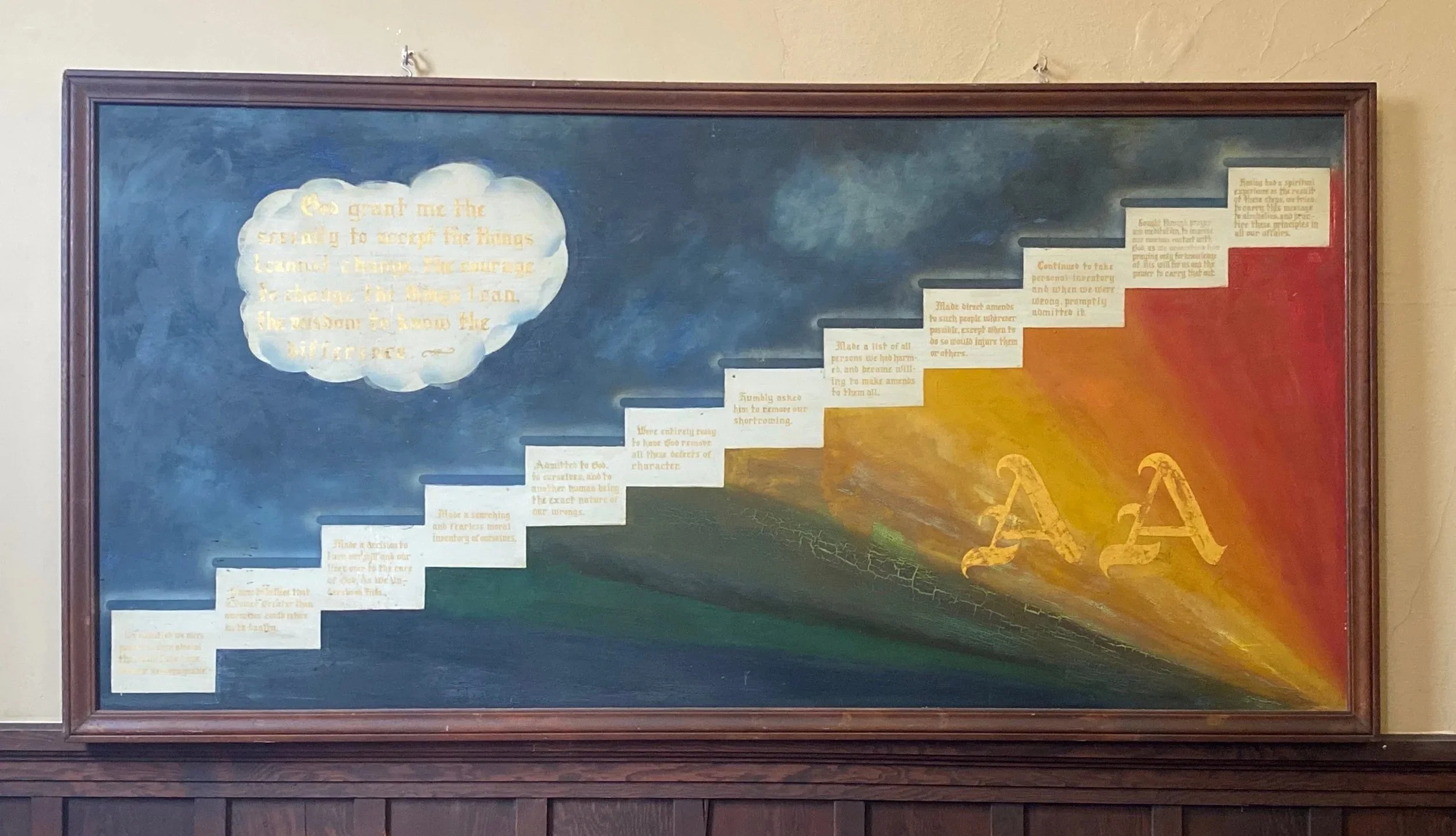 A mural with stairs containing inspirational quotes and a depiction of the sun and rays. The top of the staircase has a large cloud shape with a quote. The background transitions from dark blue to bright orange and yellow, with the letter 'A' and rays of sunlight.