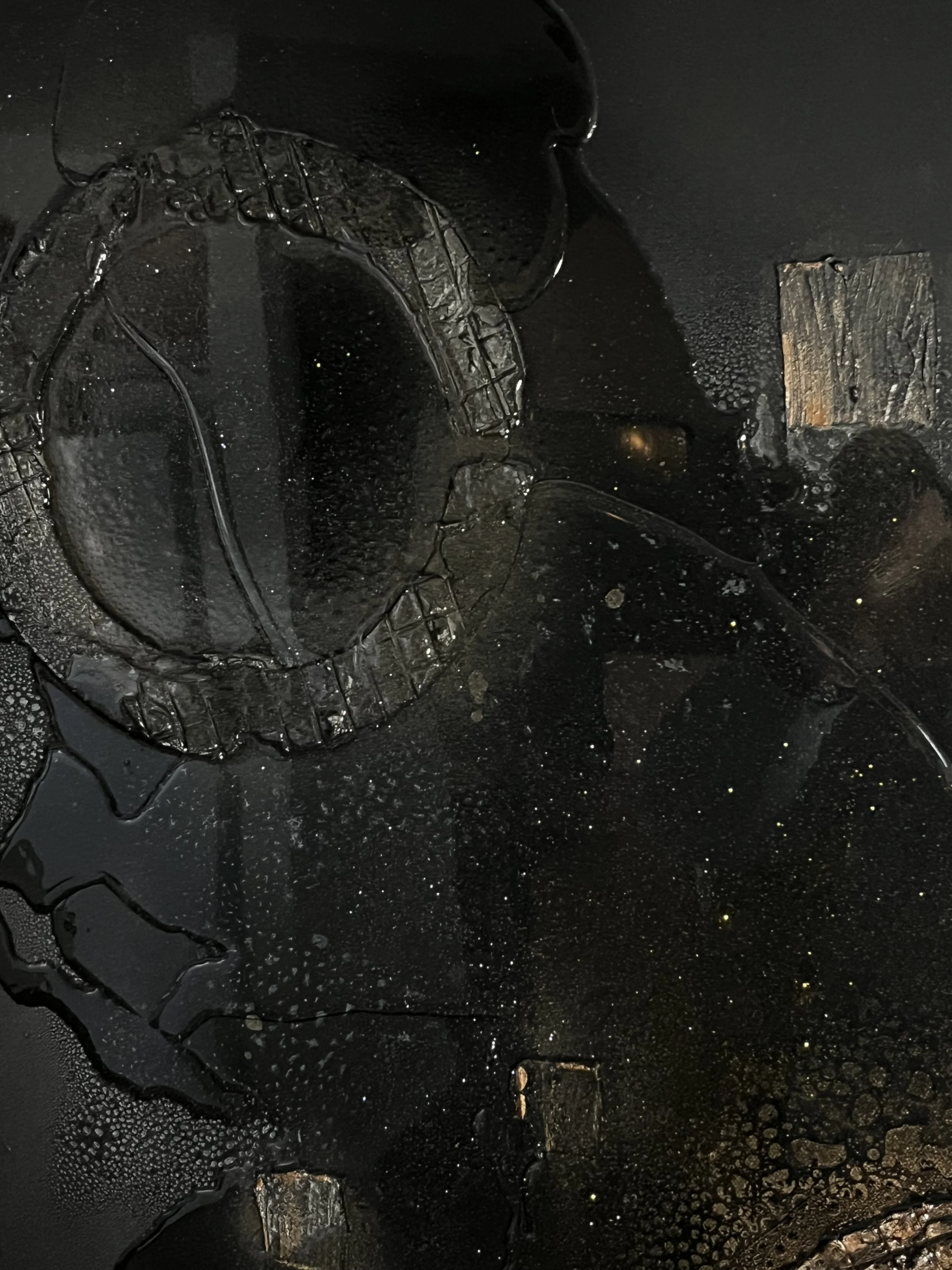 Burned, melted computer keyboard with blackened surface and damaged keys