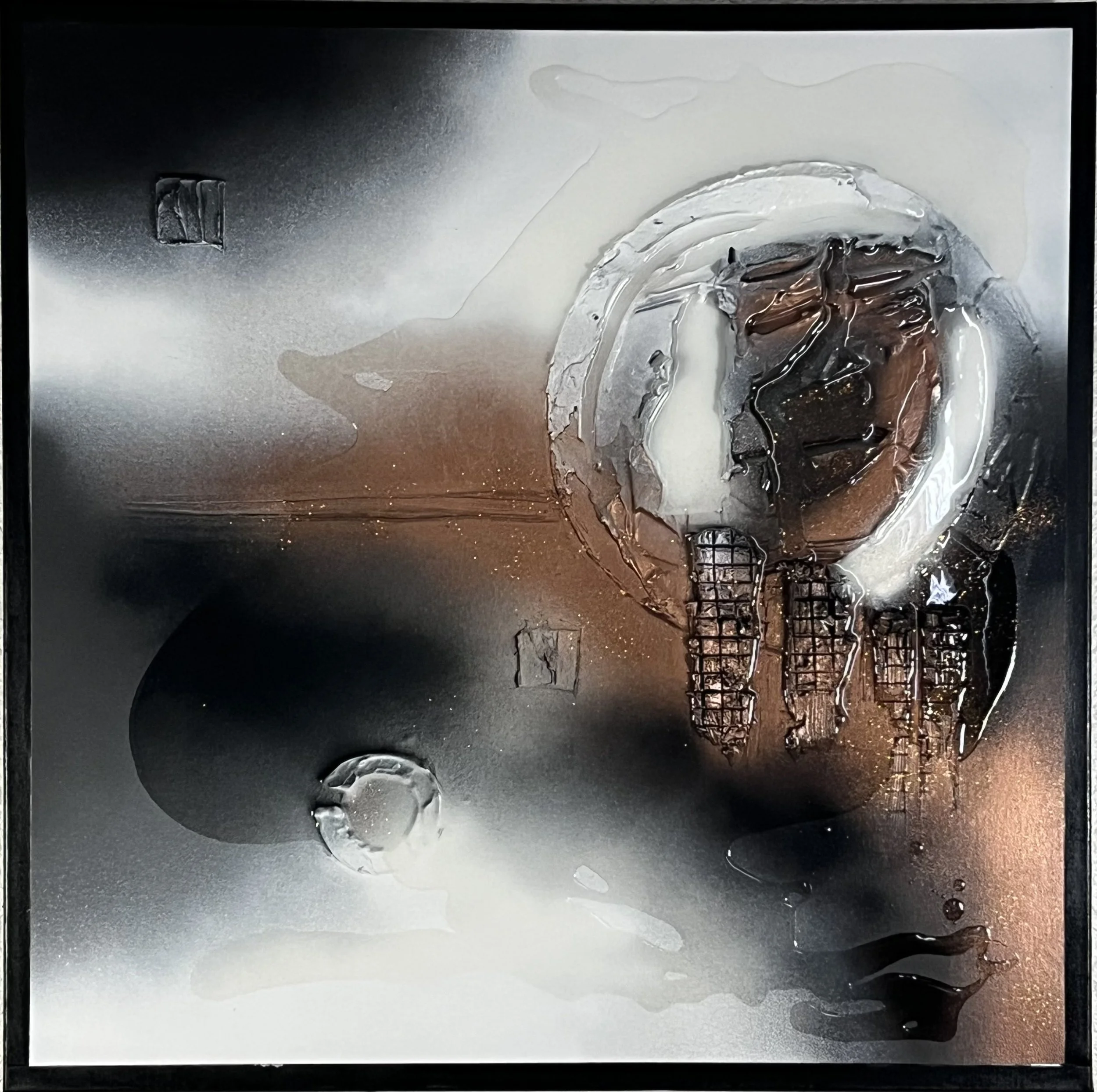 Abstract artwork featuring a metallic gray and black background with a fragmented glass-like bowl containing dark liquids. Drips and streaks of black and white are present, with some liquid spilling outward, creating a textured, layered appearance.