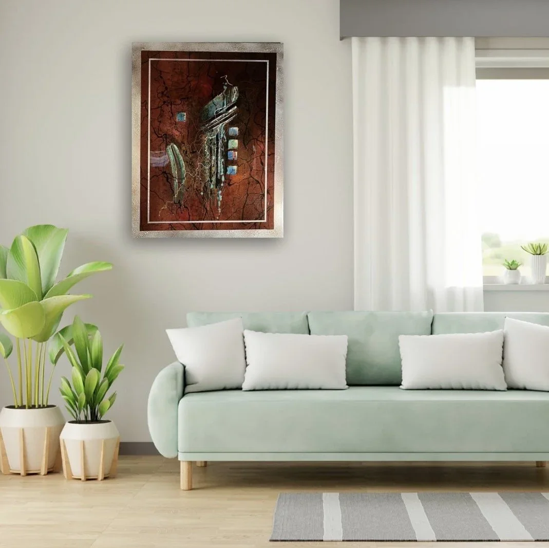 Modern living room with a light green sofa, white pillows, potted plants, abstract artwork on the wall, and white curtains.