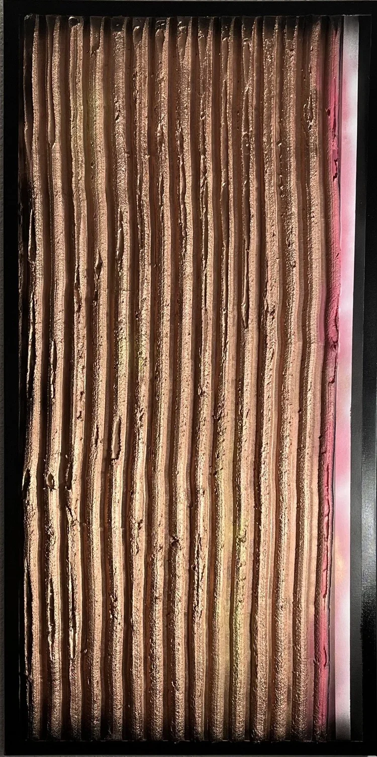 Close-up of a vertical streaked pattern with brown, beige, and pink hues.