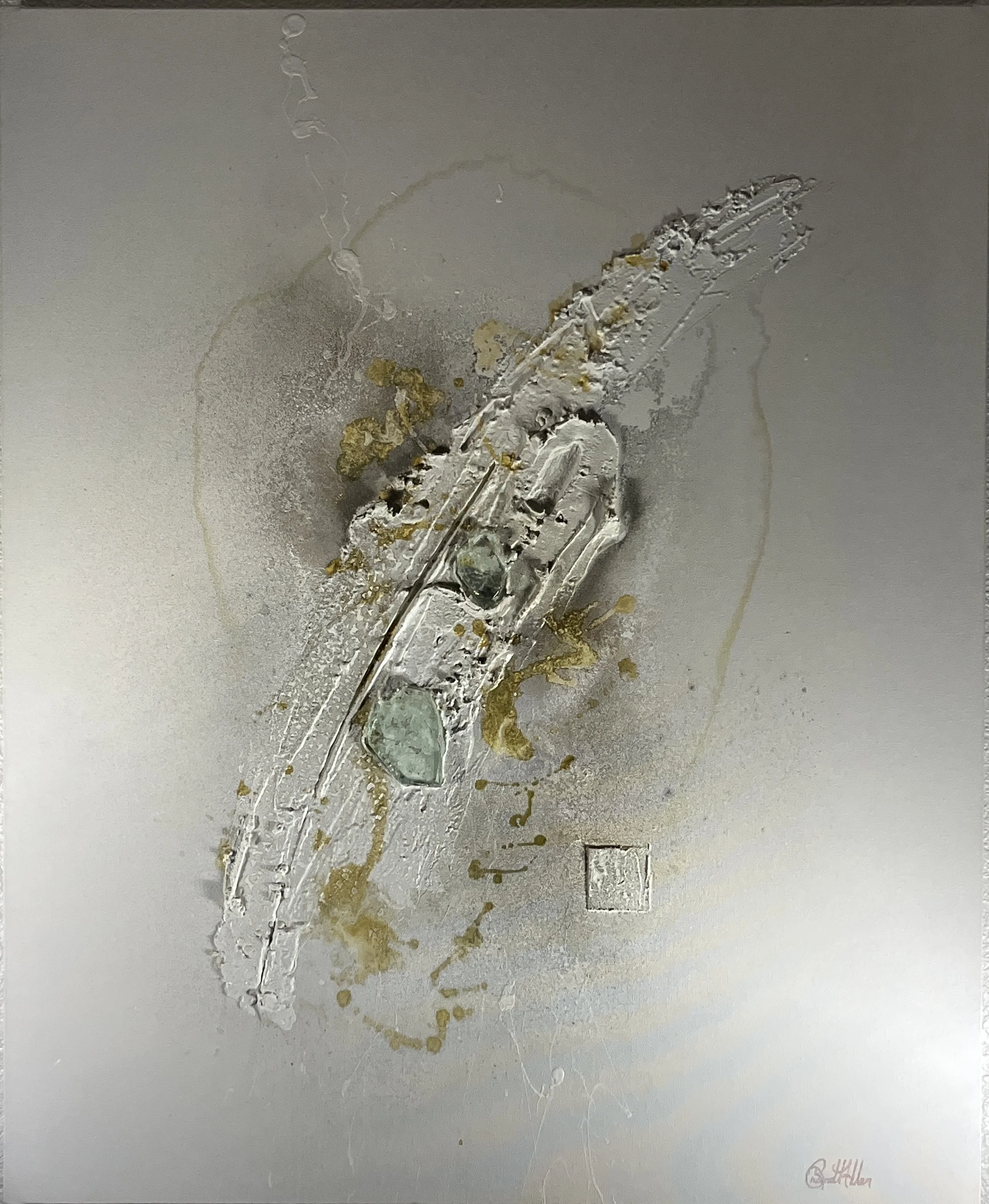 Abstract artwork featuring silver and gold metallic textures on a gray background, with a signature in the bottom right corner.