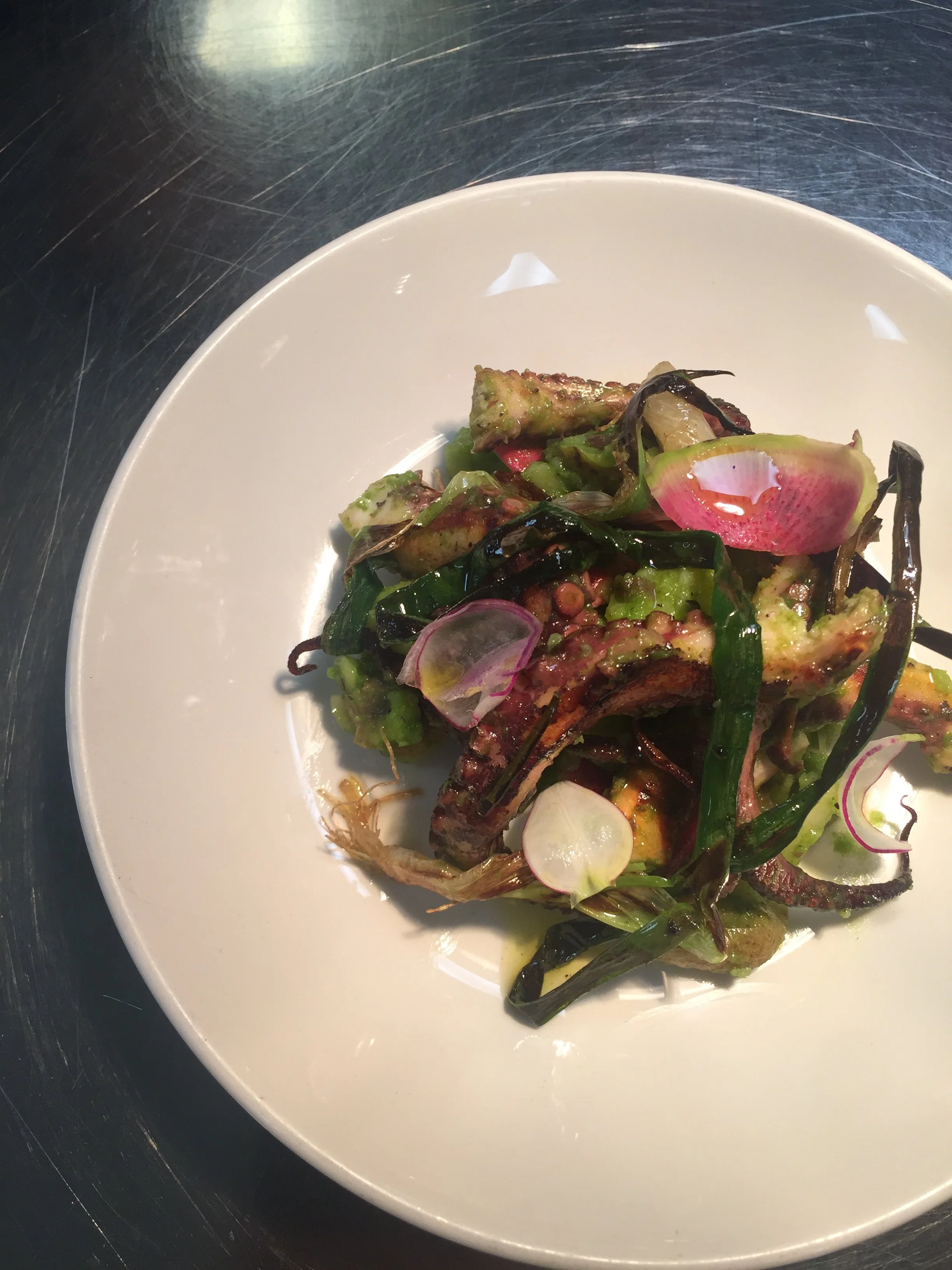 Octopus with Salsa Verde with spring vegetables