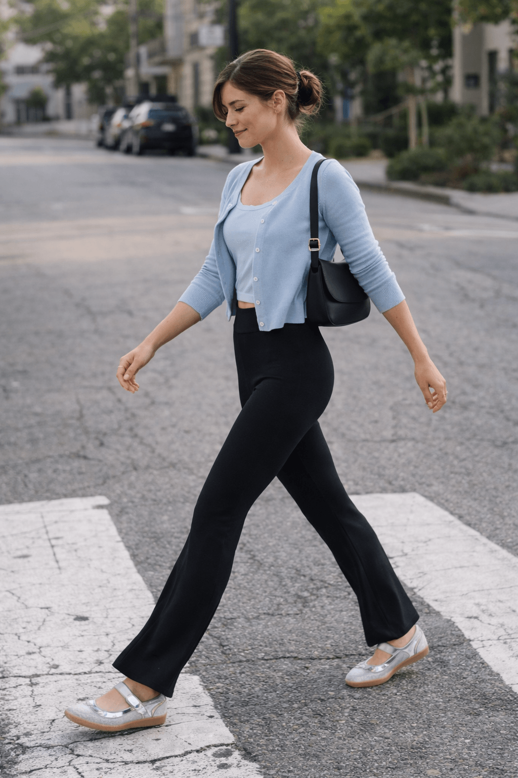Black flare leggings styled with a fitted tank top, lightweight cardigan, and ballet sneakers for an elevated summer outfit