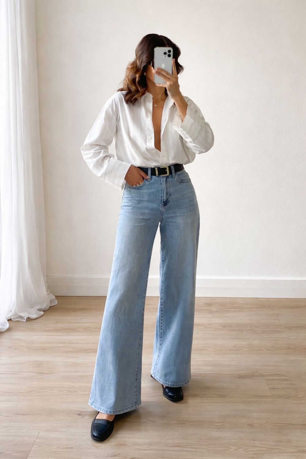 spring outfit ideas for women featuring a white button down shirt styled with wide leg jeans and black loafers
