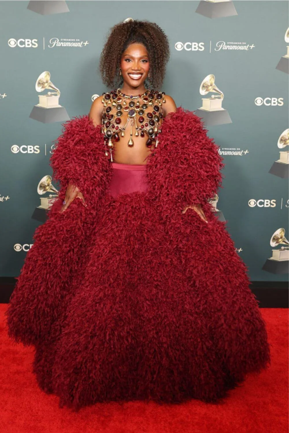 doechii-red-textured-gown-statement-silhouette-grammys.jpg