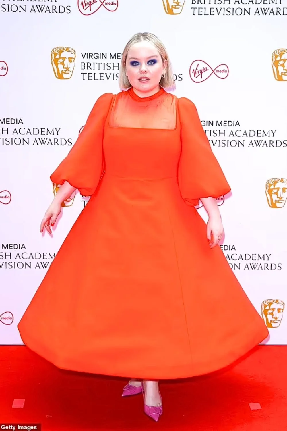 nicola-coughlan-bright-orange-a-line-gown-bold-color-red-carpet.jpg