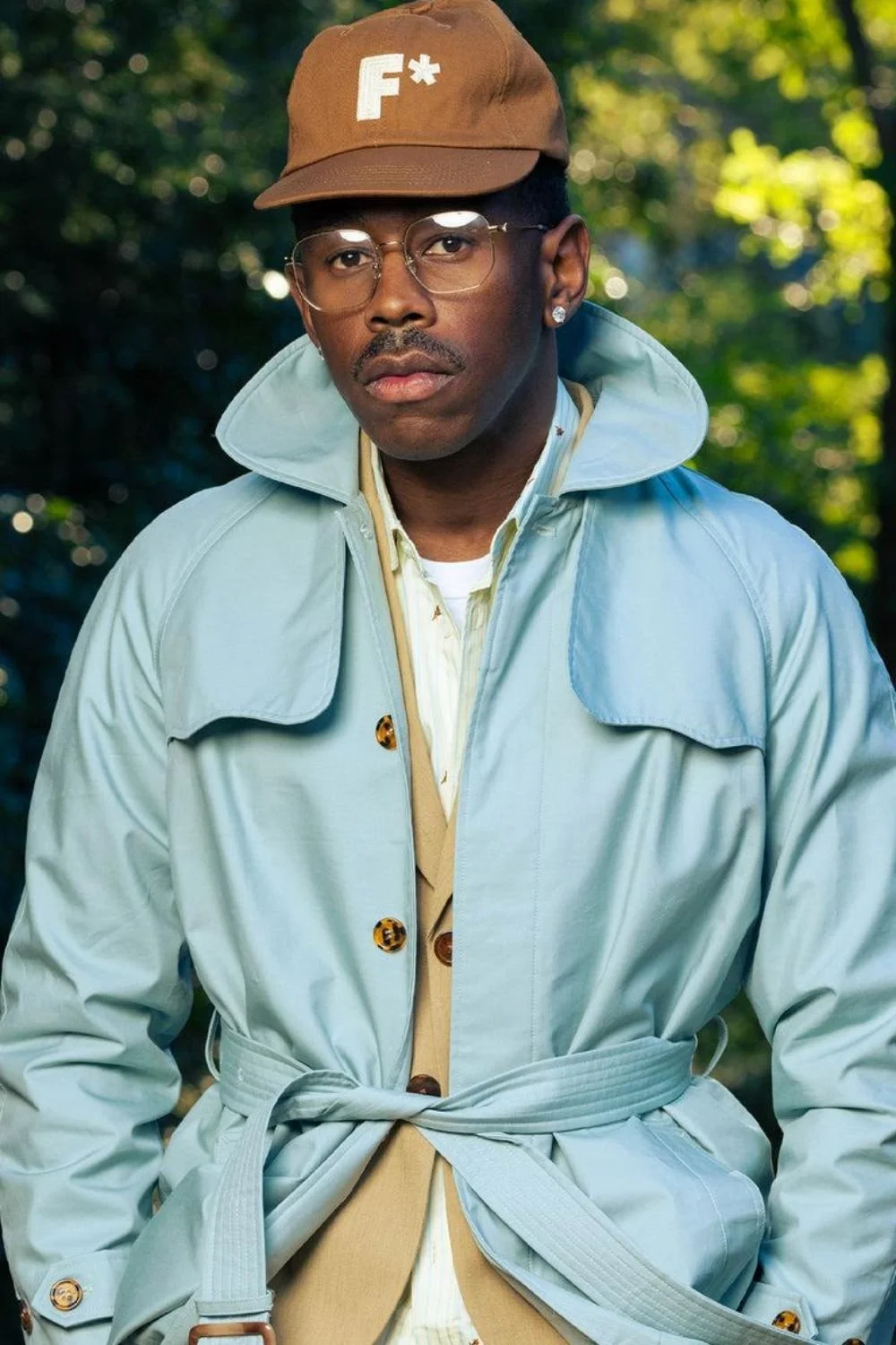 tyler-the-creator-pastel-blue-coat-layered-neutral-outfit.jpg