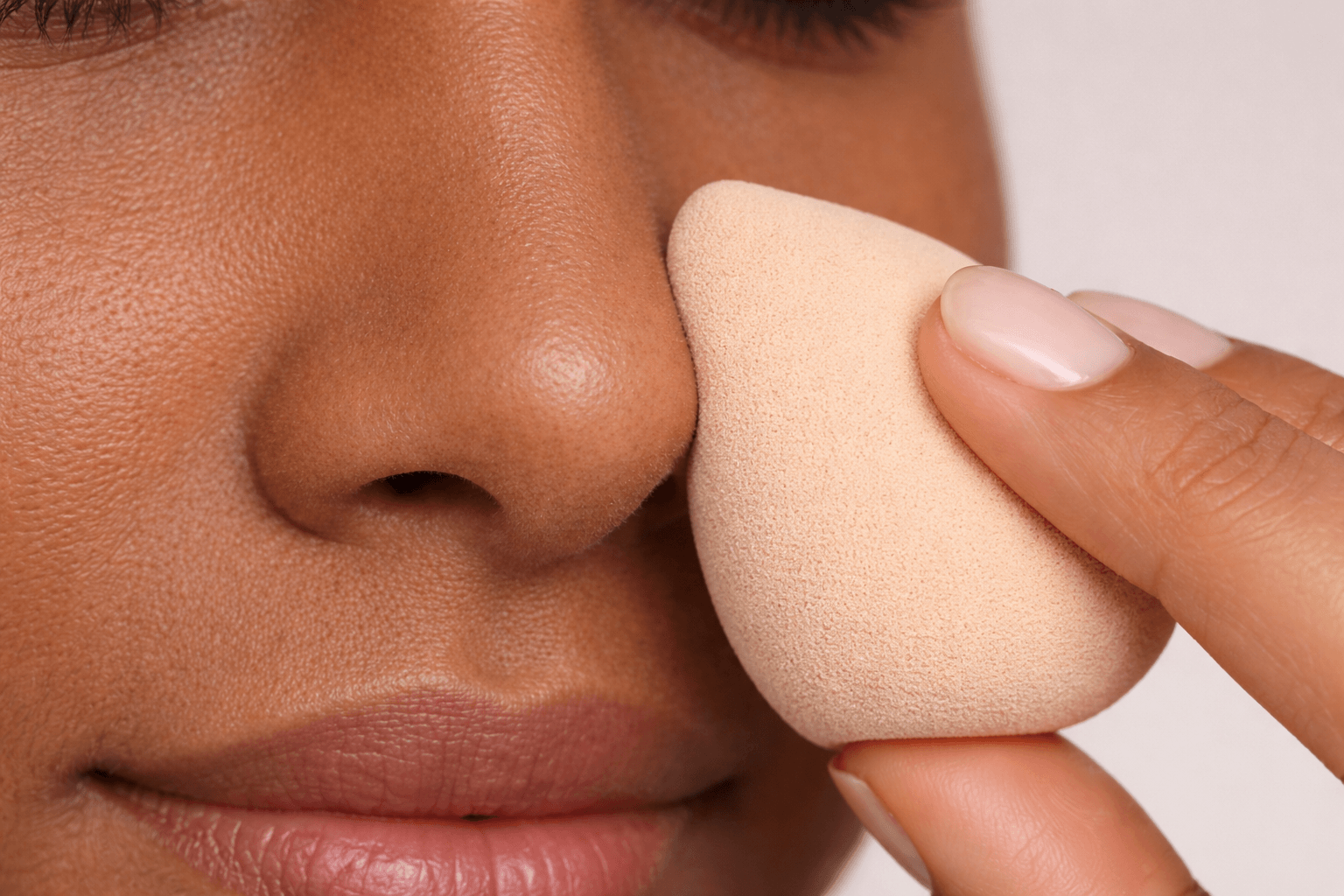 Pressing foundation into nose with makeup sponge instead of swiping to prevent separation