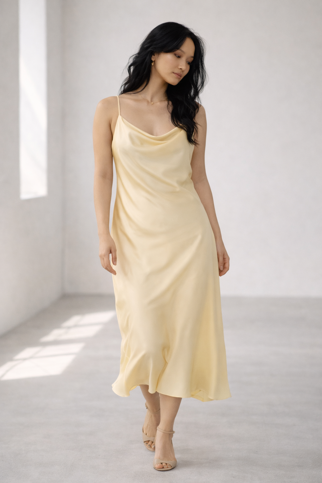 runway-style butter yellow slip dress with soft draping representing the spring summer 2026 fashion color trend
