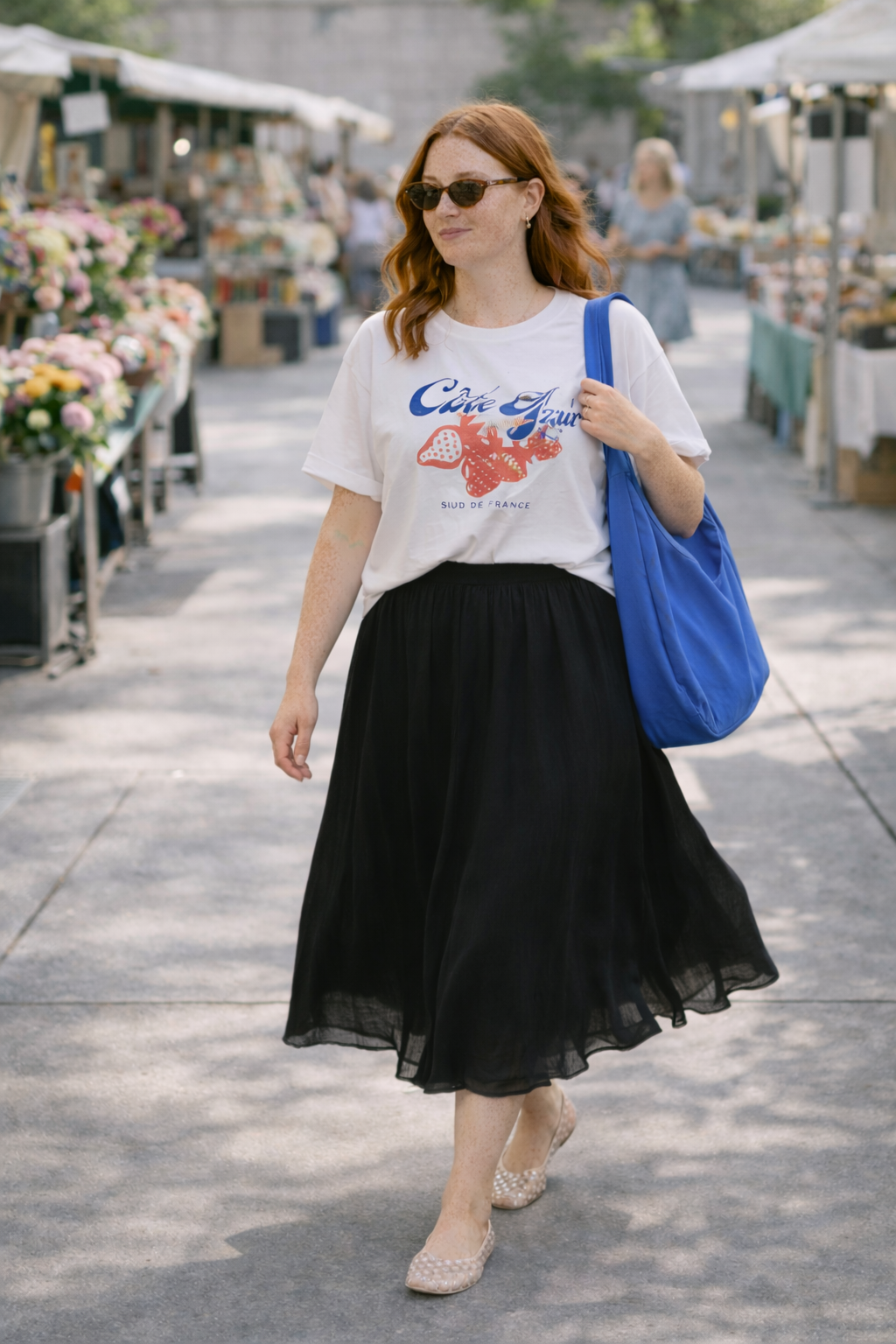 transitional spring outfit graphic tee black midi skirt casual spring outfit warm afternoon cool morning
