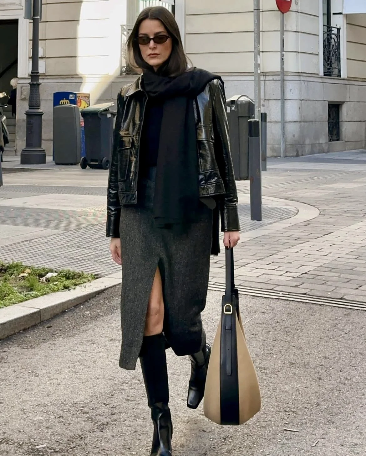 grey midi skirt outfit with leather jacket and knee high boots