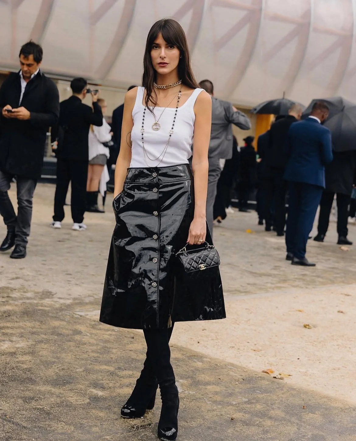 black patent leather skirt outfit styled with white tank top