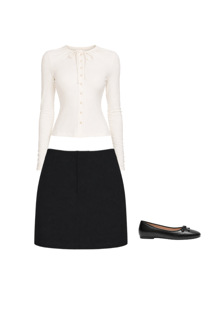 Black ballet flats worn with structured black mini skirt and fitted long-sleeve ivory top for a sharp, leg-lengthening silhouette.