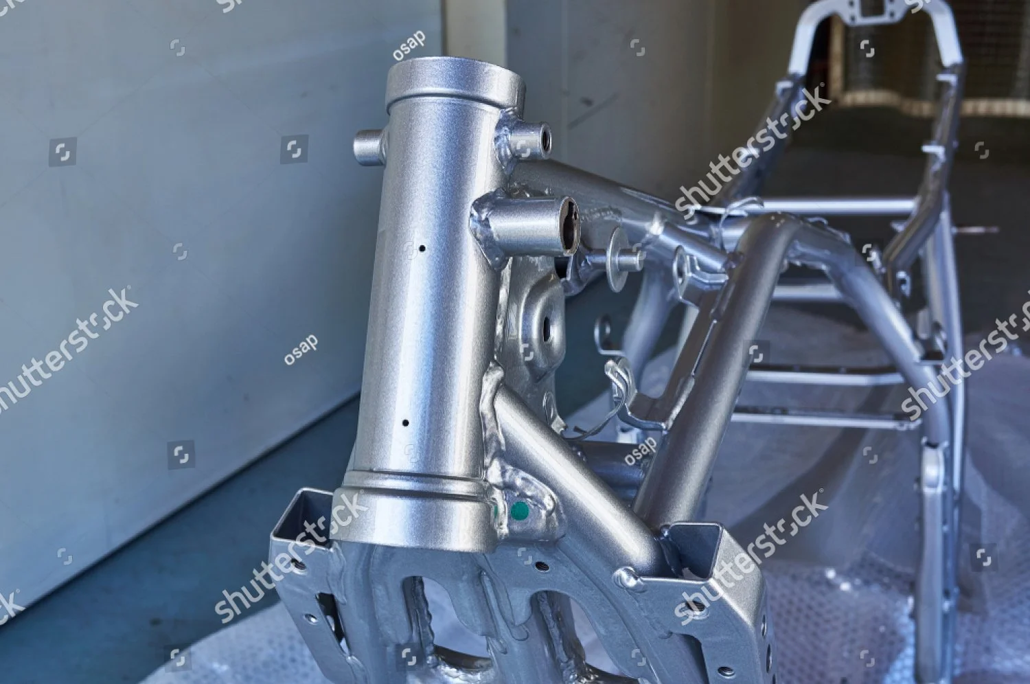 stock-photo-maintenance-of-motorcycles-frame-after-powder-coating-1173204646.jpg
