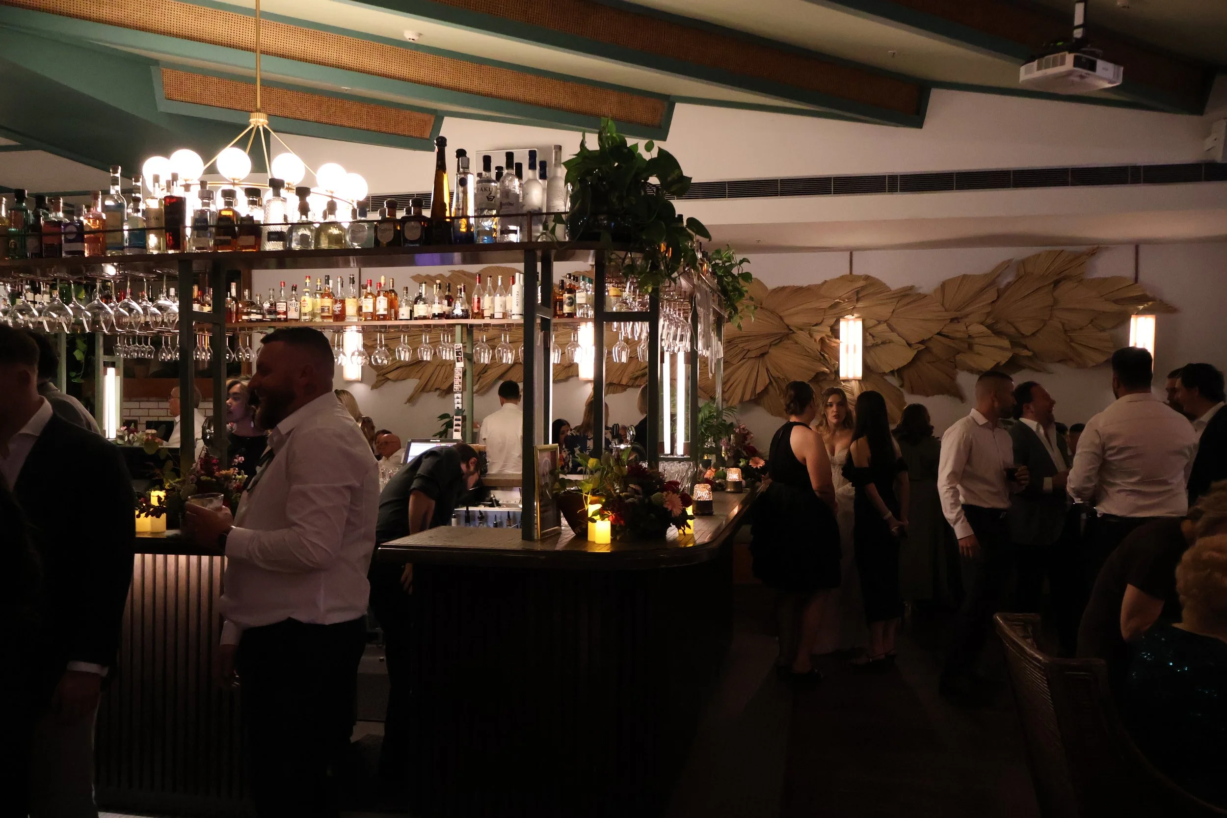 Wedding guests mingling at the bar at Verandah Bar, Sydney