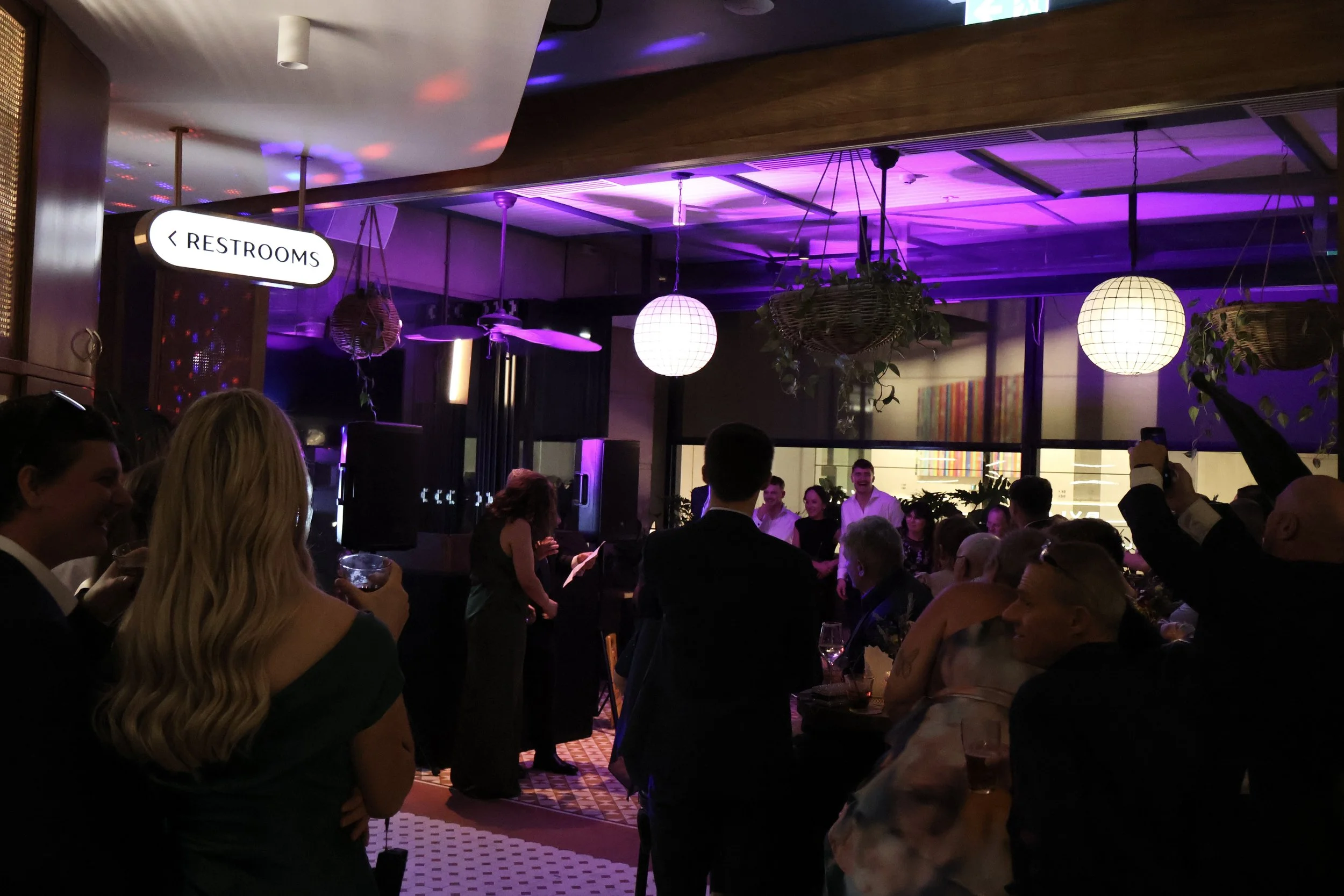 Wedding reception dancefloor under purple lighting at Verandah Bar, Sydney