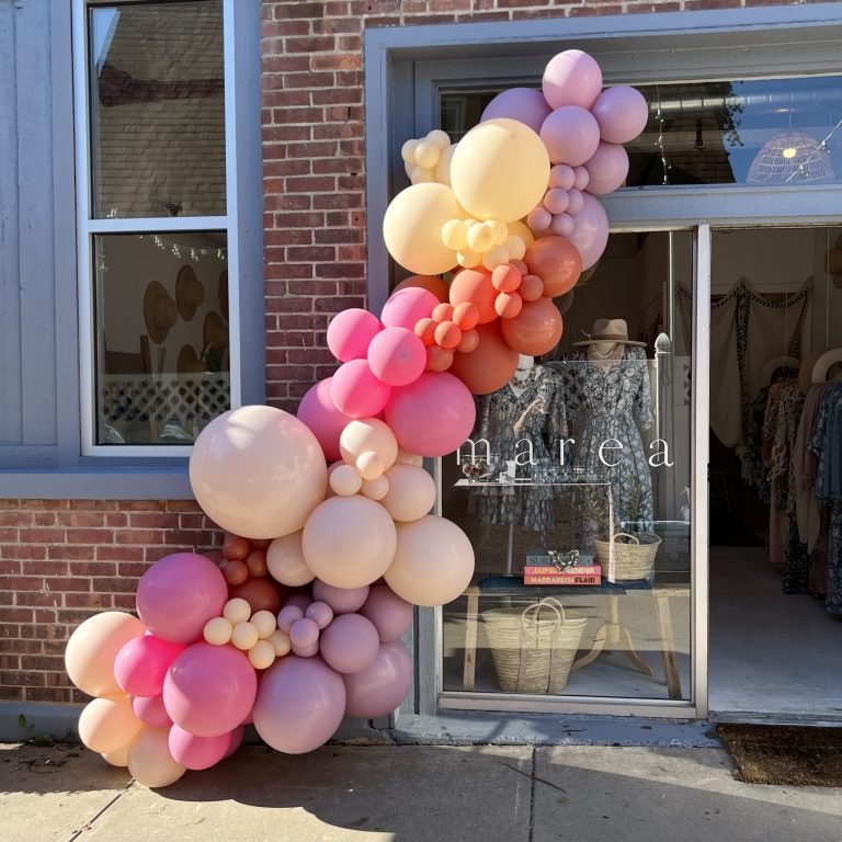 Balloon garland in muted pinks, burnt orange and neutrals for grand opening and brand launch of Marea store in Fairfield CT.