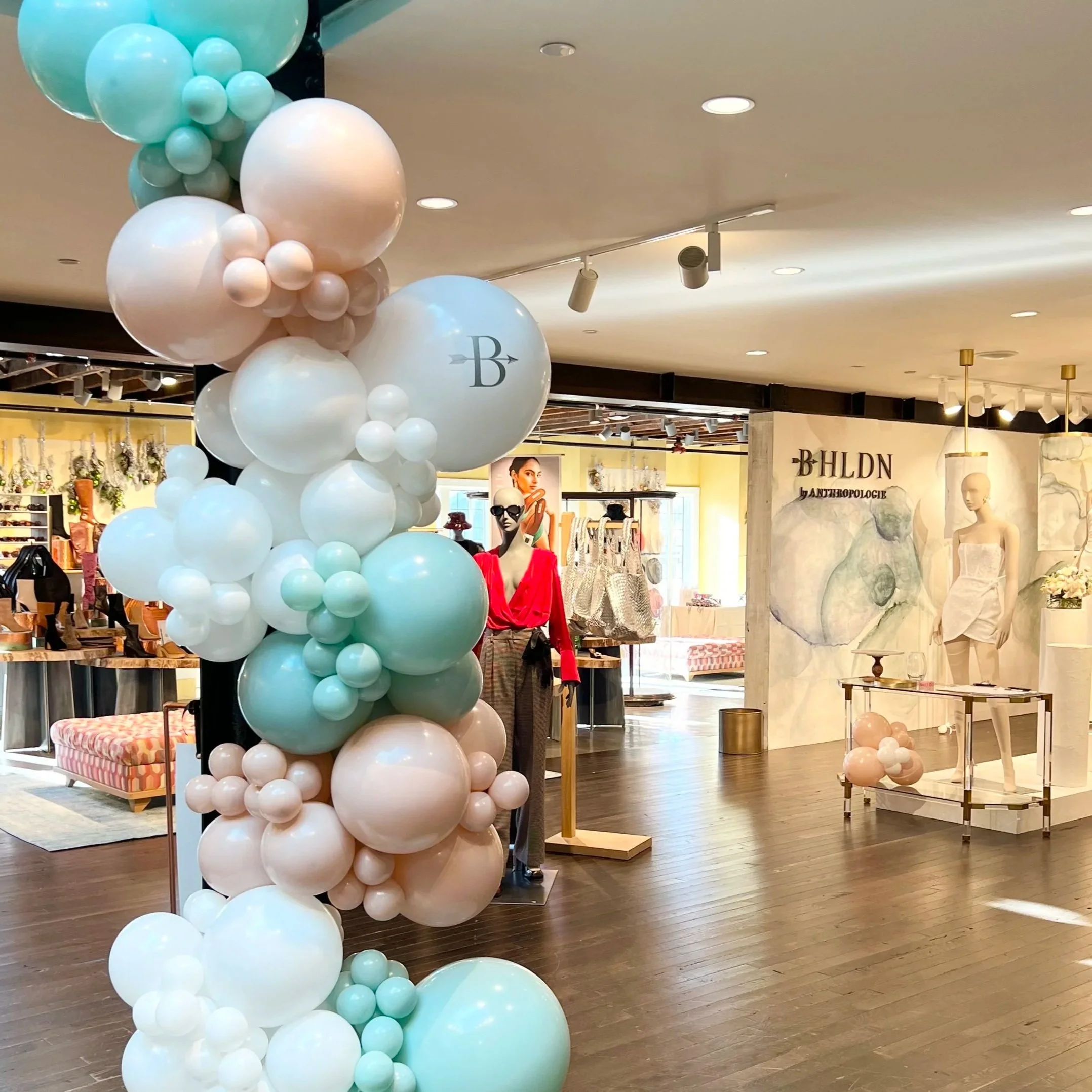 Balloon Garland in light green white and blush for BHLDN wedding event at Anthropologie Westport CT