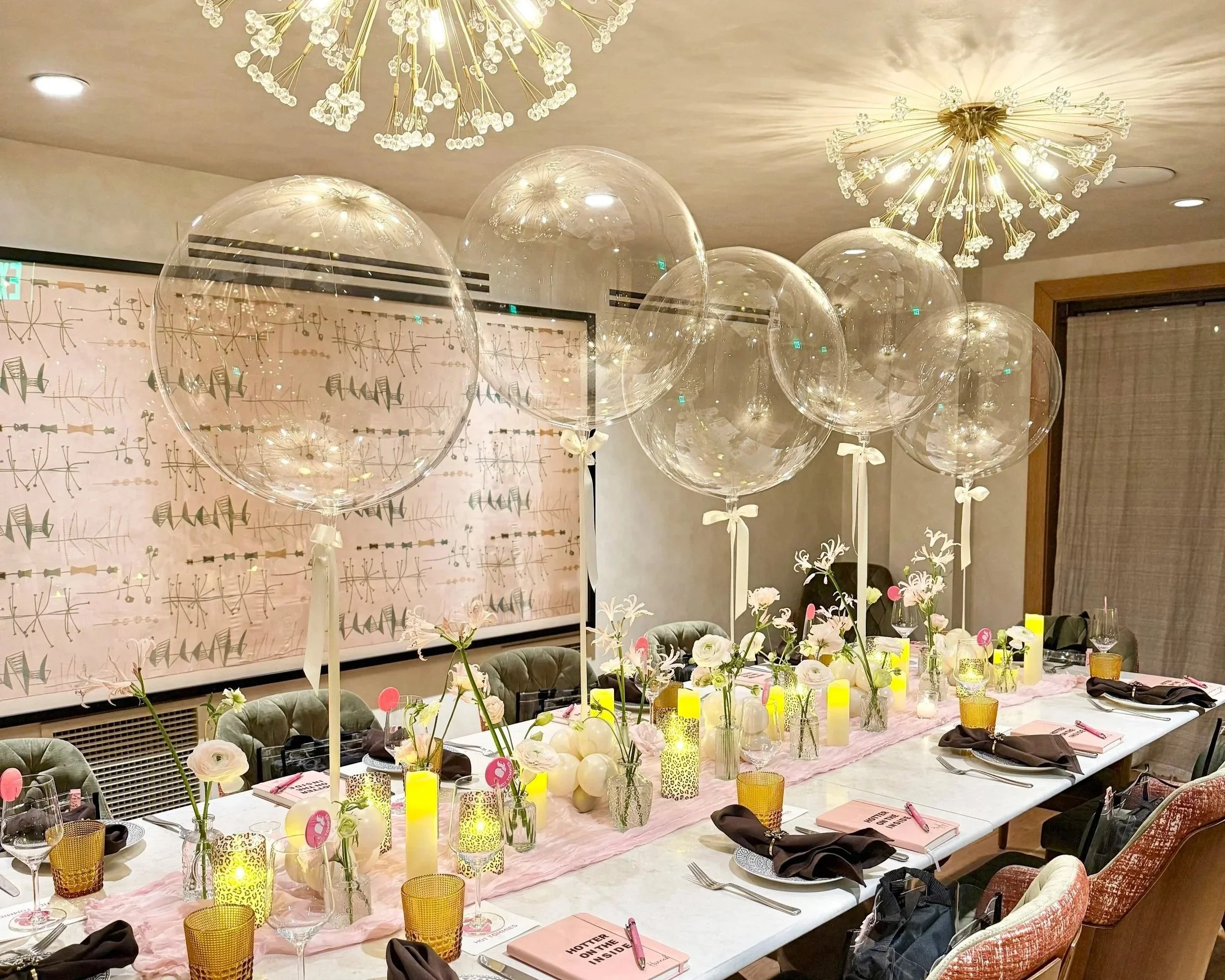 Clear bubble balloon centerpieces at Dandelion Westport at the Delamar hotel.