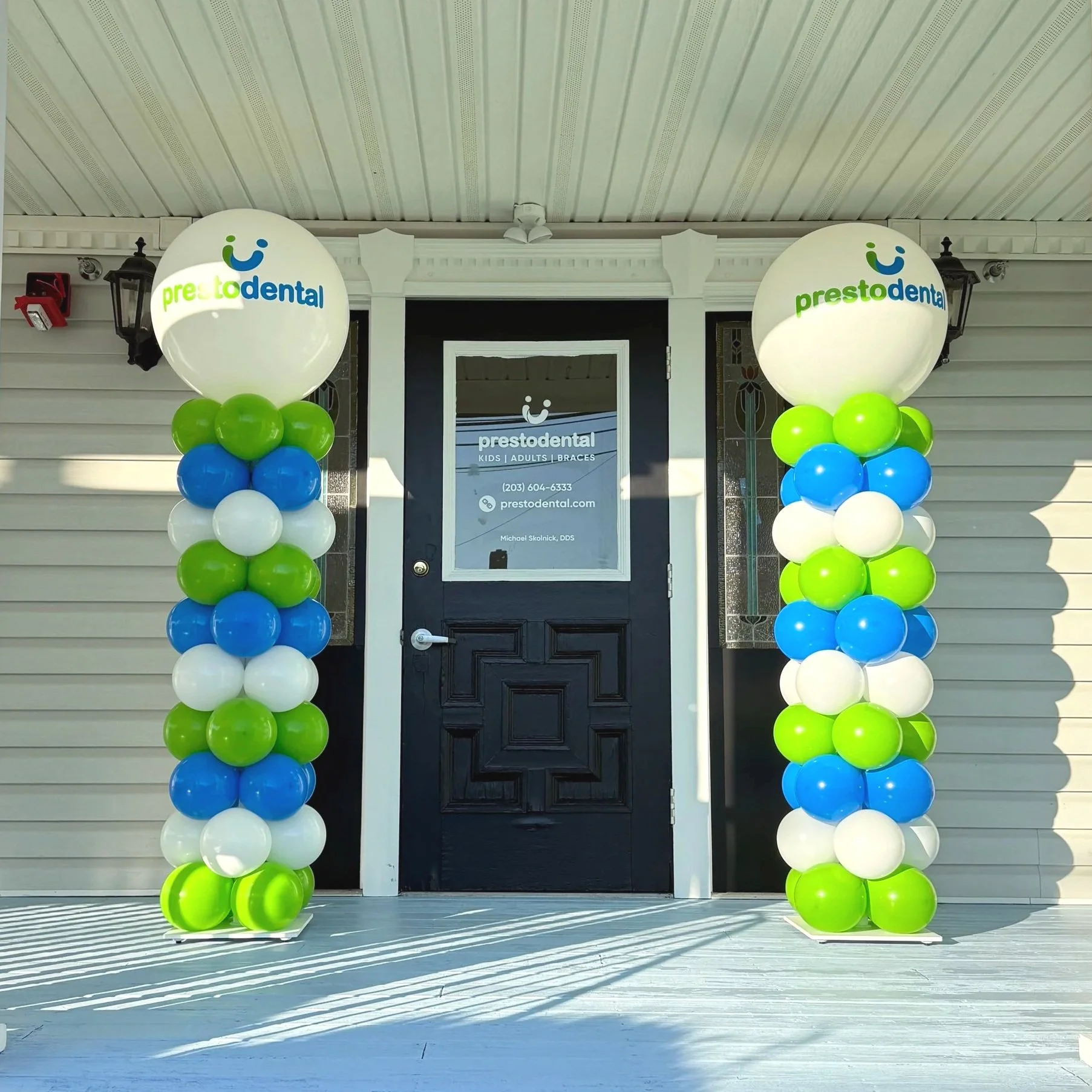 Balloon columns in white, bright blue and lime for Grand Opening of Presto Dental in Bridgeport CT