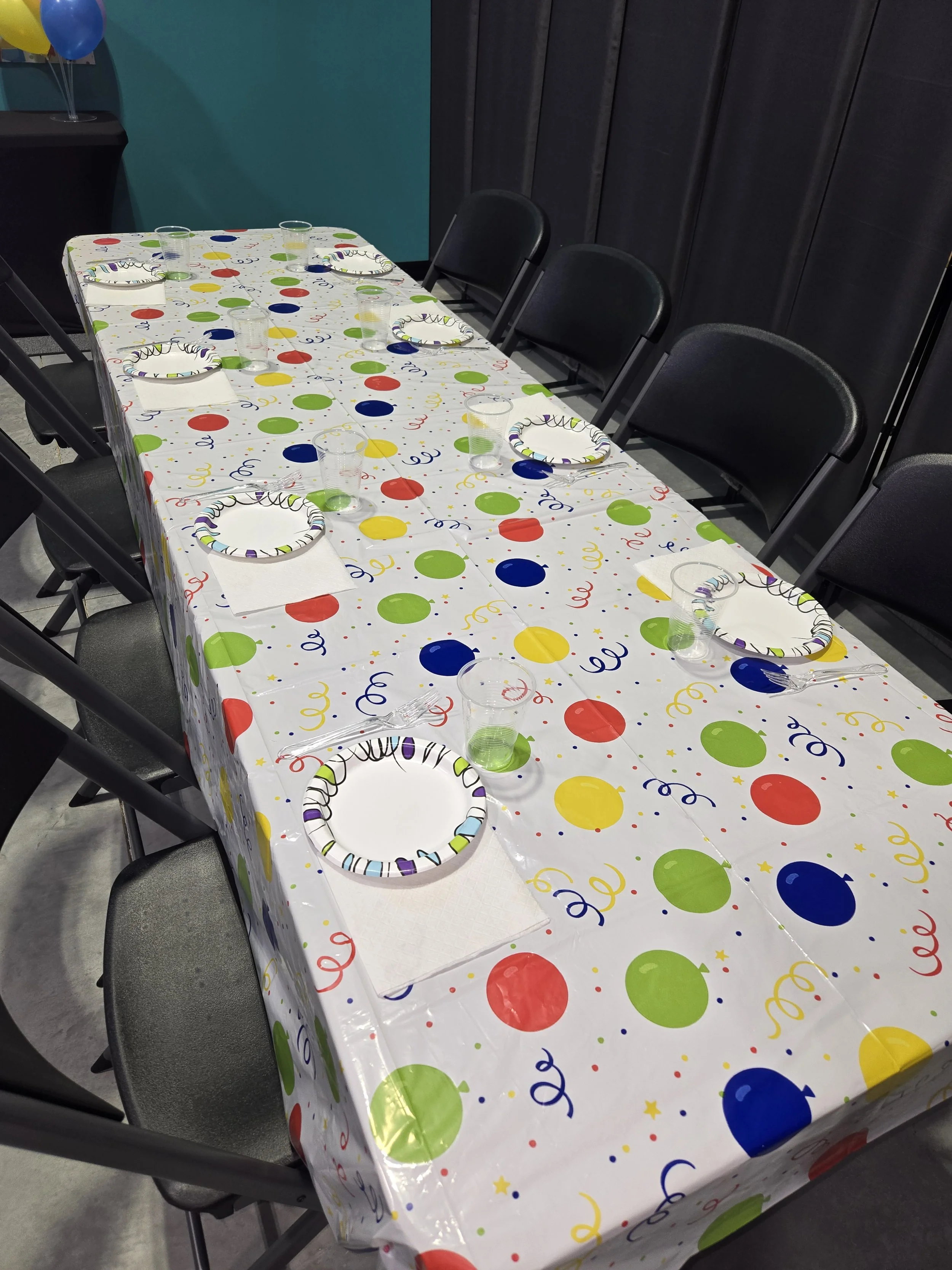 Napkins, plates, utensils, and cups are provided.