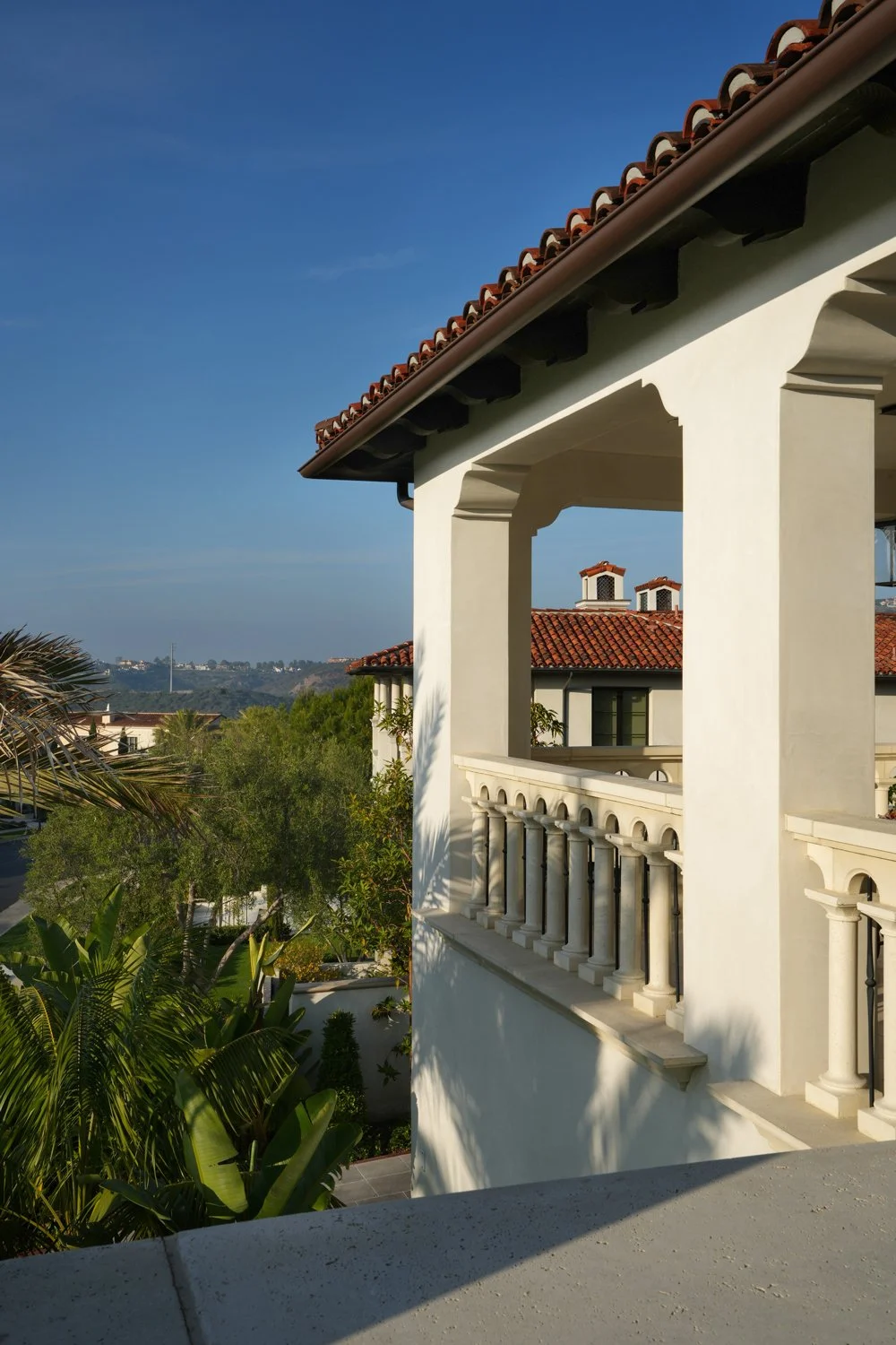 White Luxury Home with Mediterranean Style Overlooking Garden