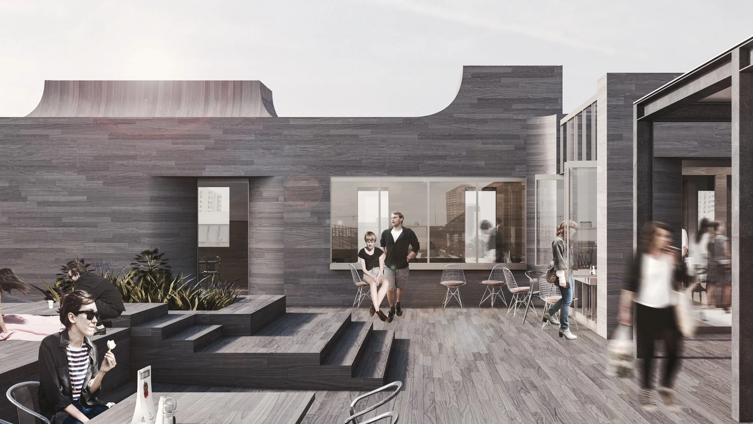 Modern outdoor patio area with people sitting and walking, gray wooden structure, large windows, stairs, and seating area.