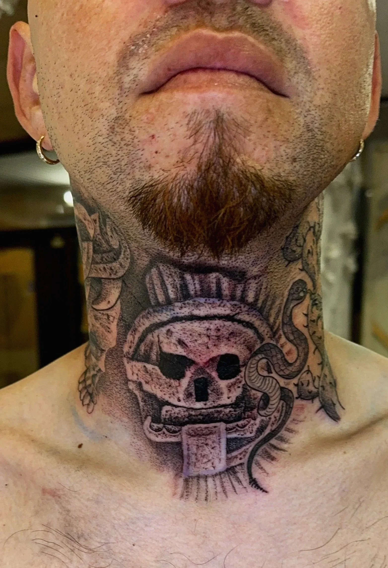 Mictlantecuhtli neck tattoo