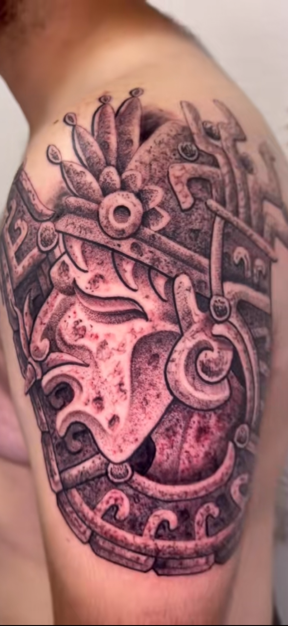 aztec stone face tattoo