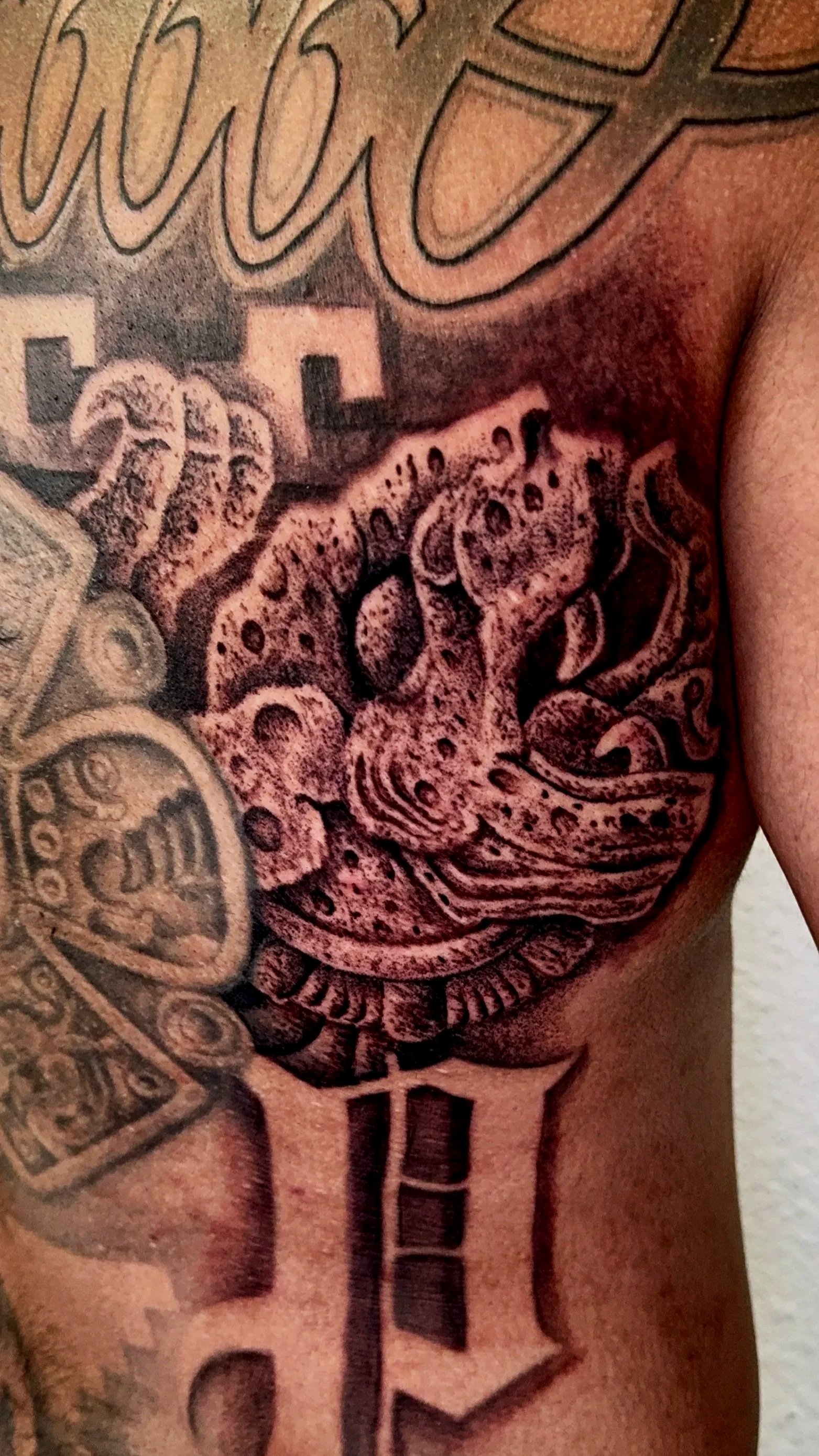 realistic aztec jaguar stone back tattoo 