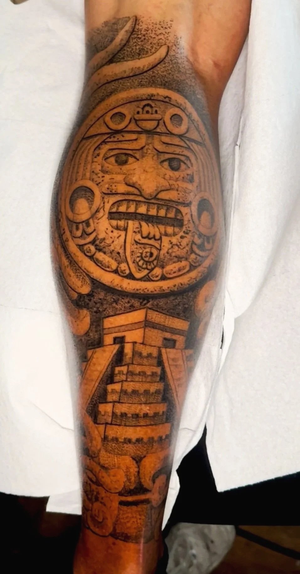 aztec calender and pyramid tattoo