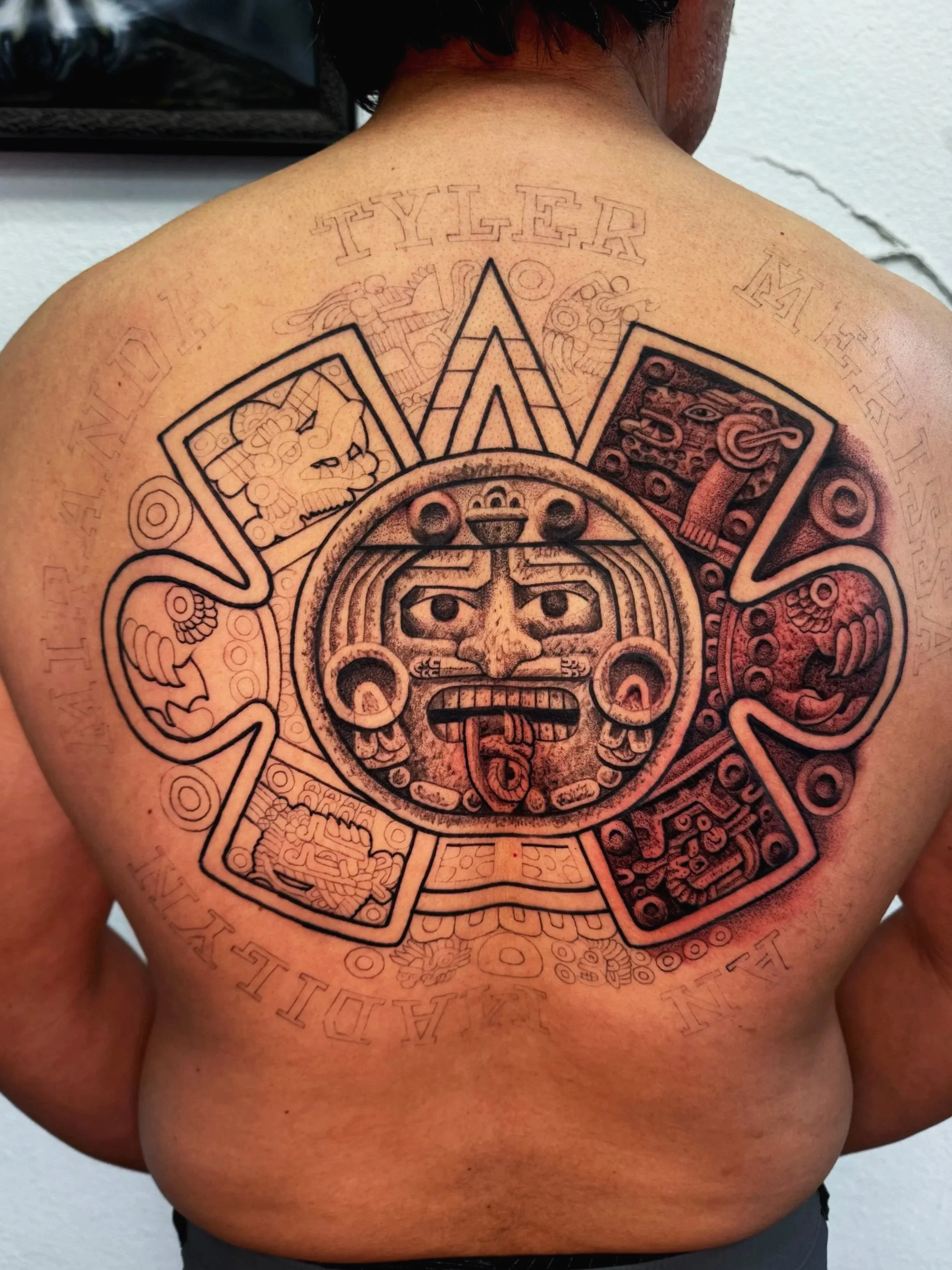 aztec calender back tattoo