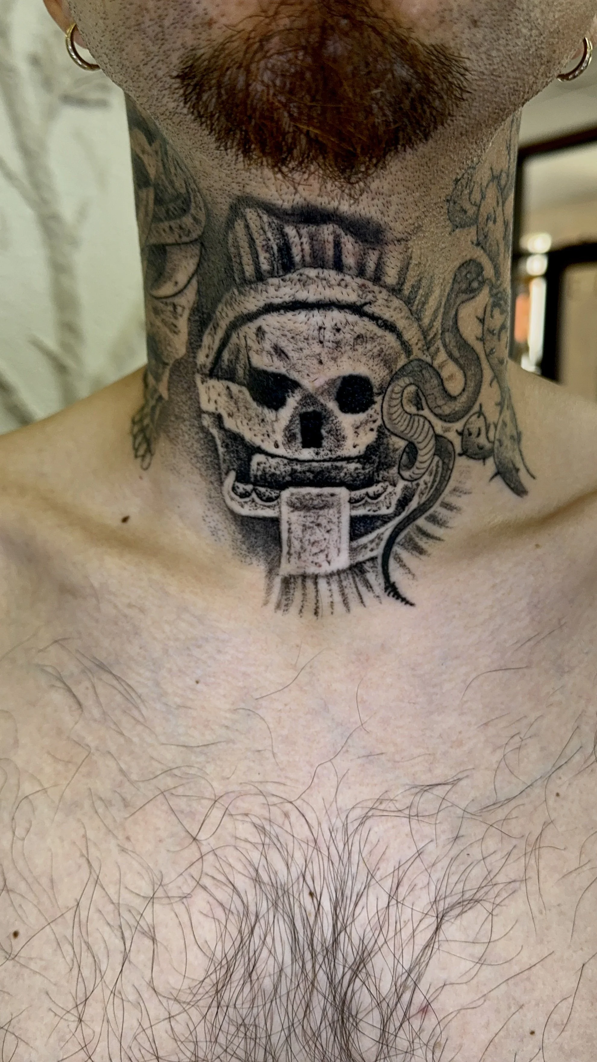 healed Mictlantecuhtli tattoo