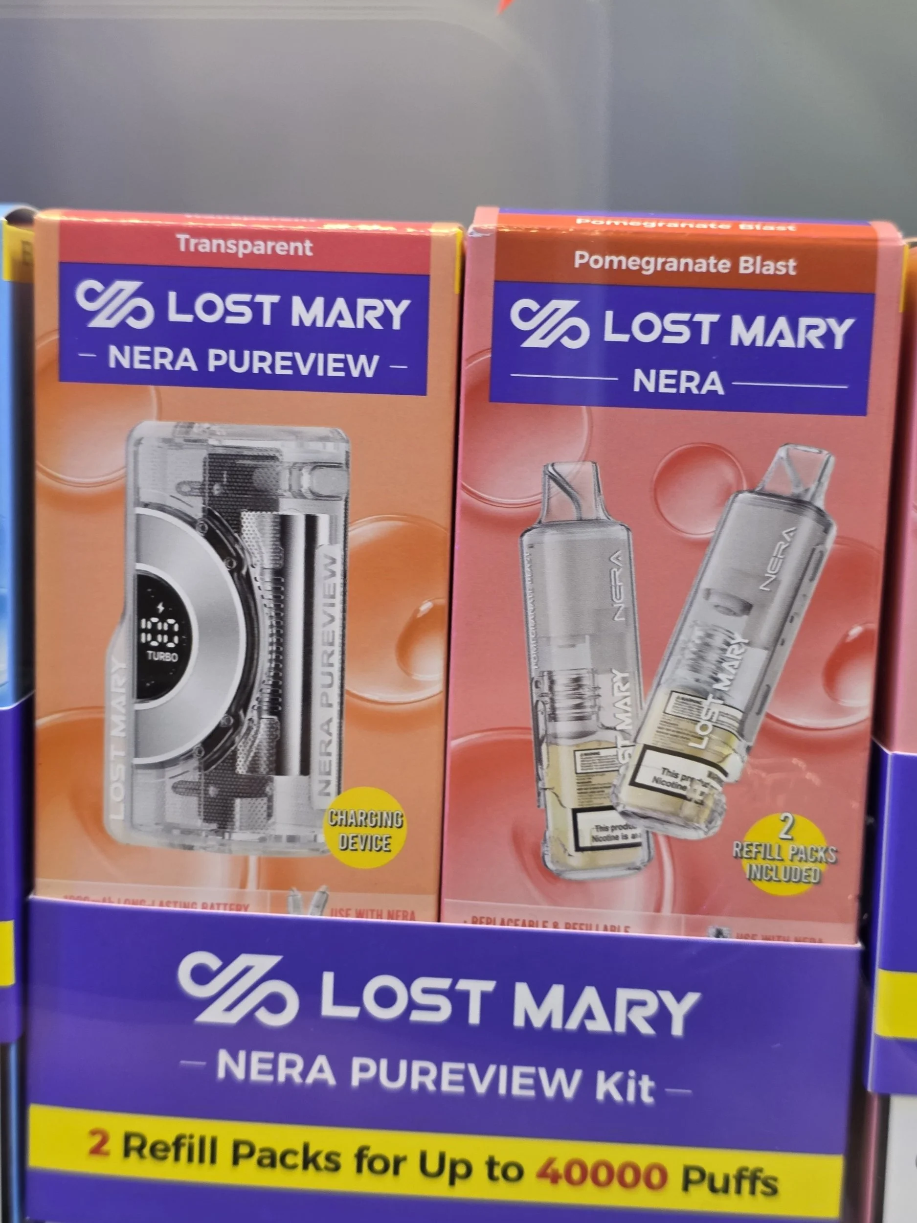 Packaging of Lost Mary NERA Pureview kit with two refill packs and rechargeable vaping device, on store shelf.