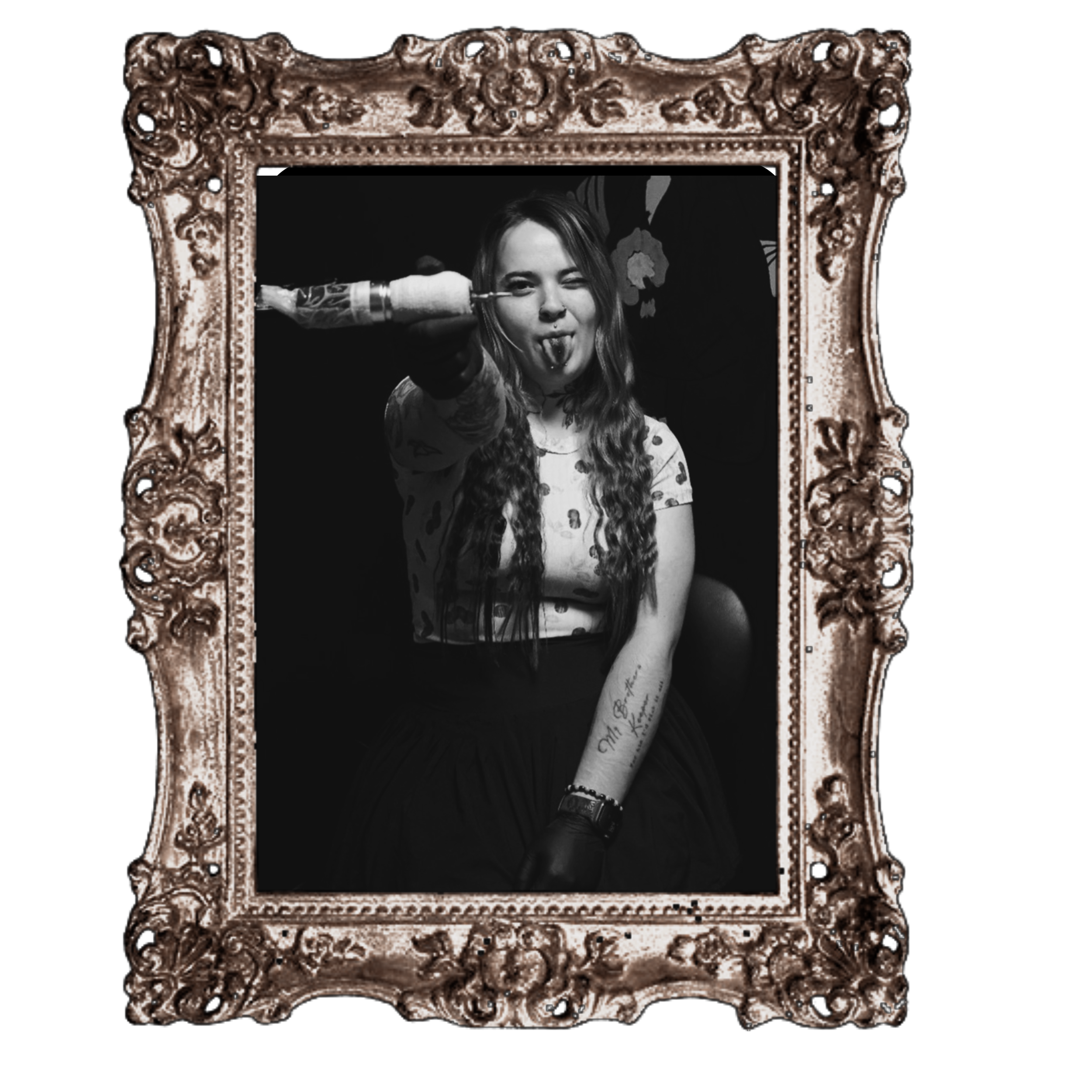 Black and white photo of Crazy Vic winking and sticking her tongue out, behind an ornate gilded mirror frame.