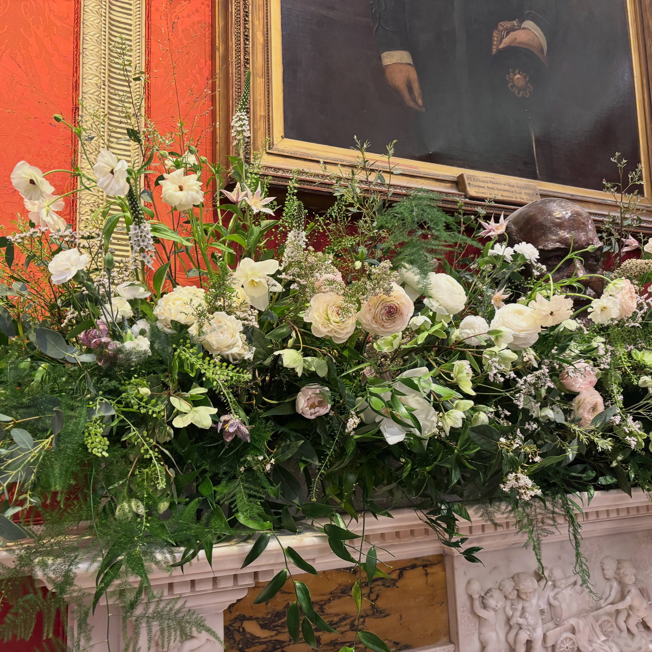 For Laura &amp; Rory who married at @royalautomobileclub in March 💛🌸 a spring-filled mantel with gorgeous tulips, ranunculus, fritillaria, narcissus and hellebores ✨