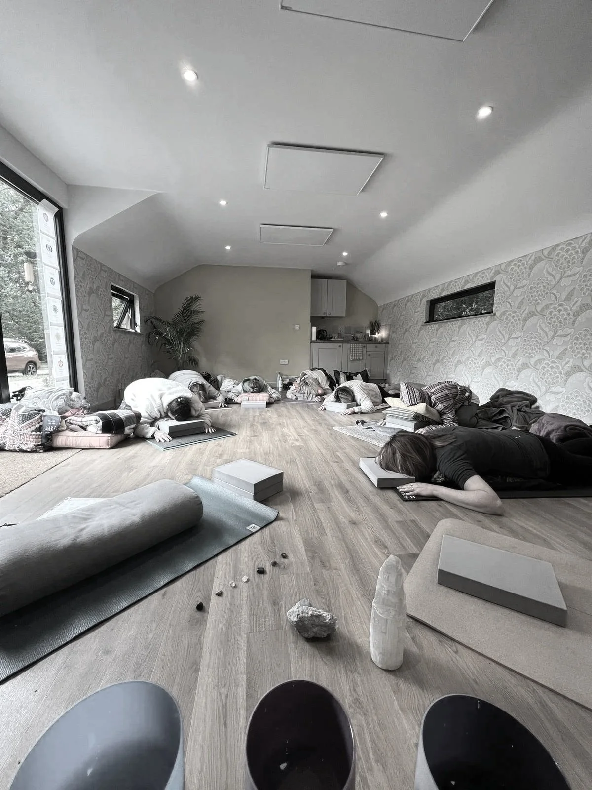 a small group of people in a relaxing yoga class in Southampton