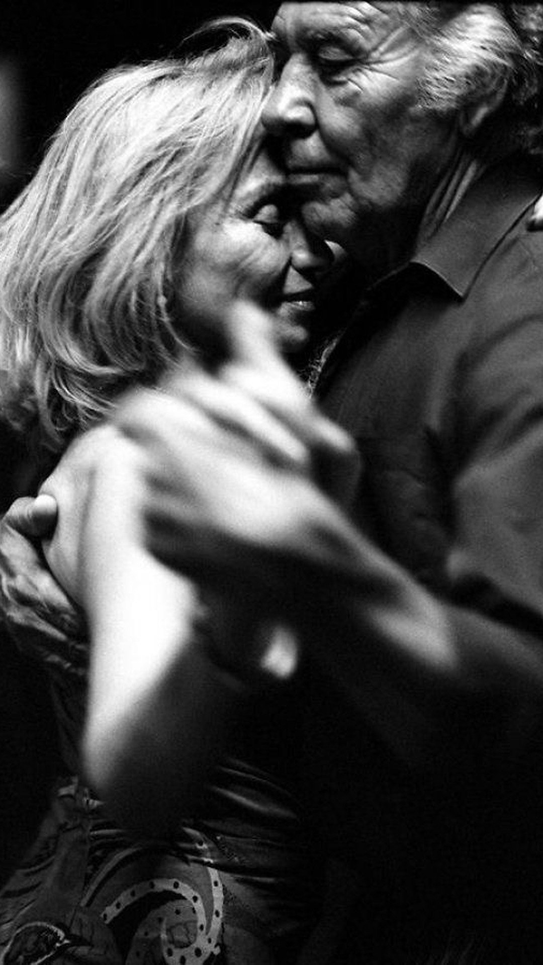 Senior couple dancing together in a close embrace, demonstrating rekindled intimacy and deep emotional bond.