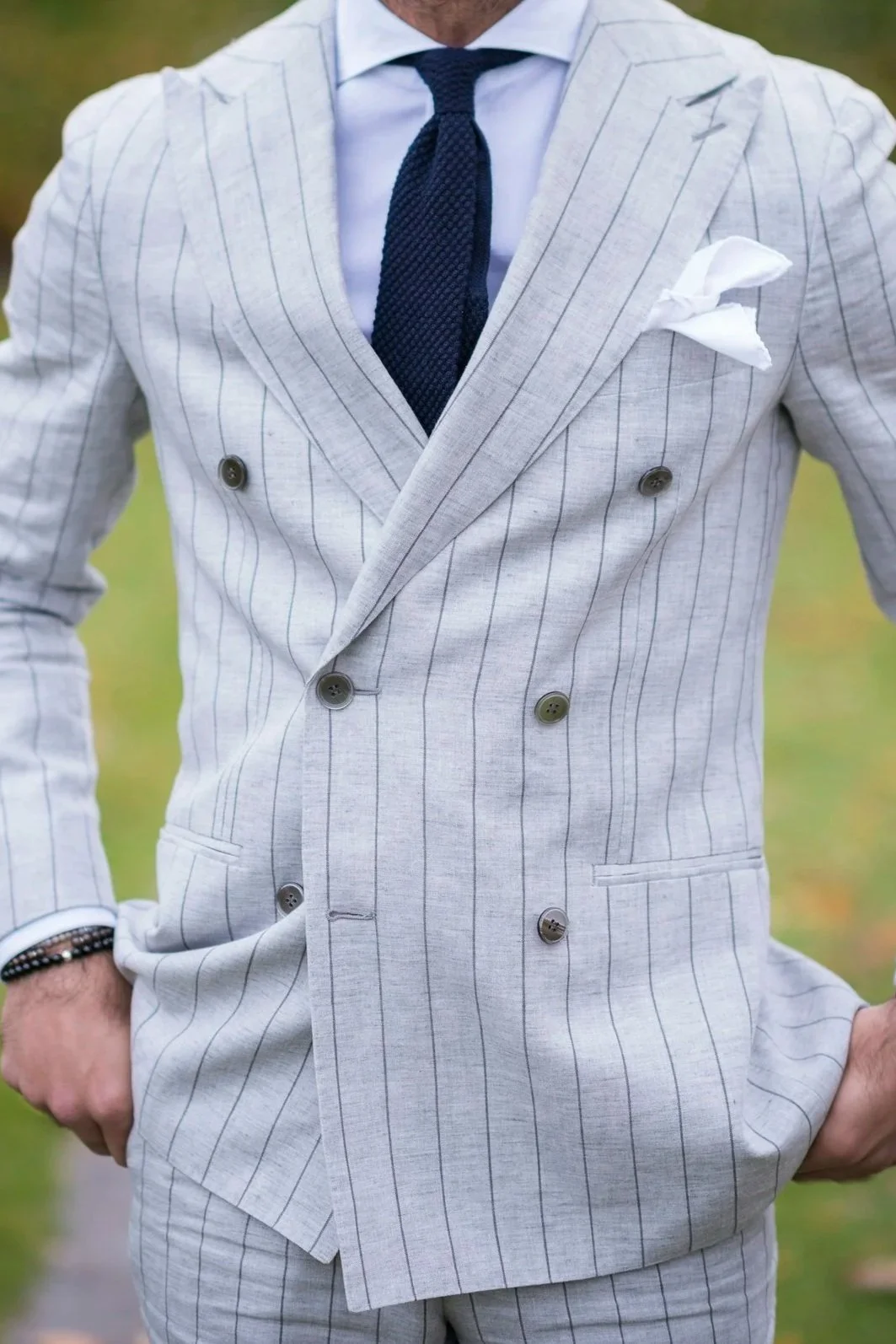 A professionally dressed man outdoors, representing confidence, presence, and moving past performance pressure through individual somatic sex coaching.