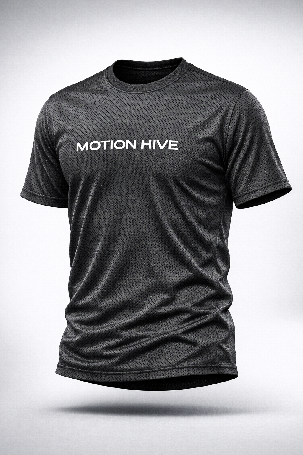 Black Nike athletic T-shirt with perforated fabric and the words "MOTION HIVE" printed on the front.