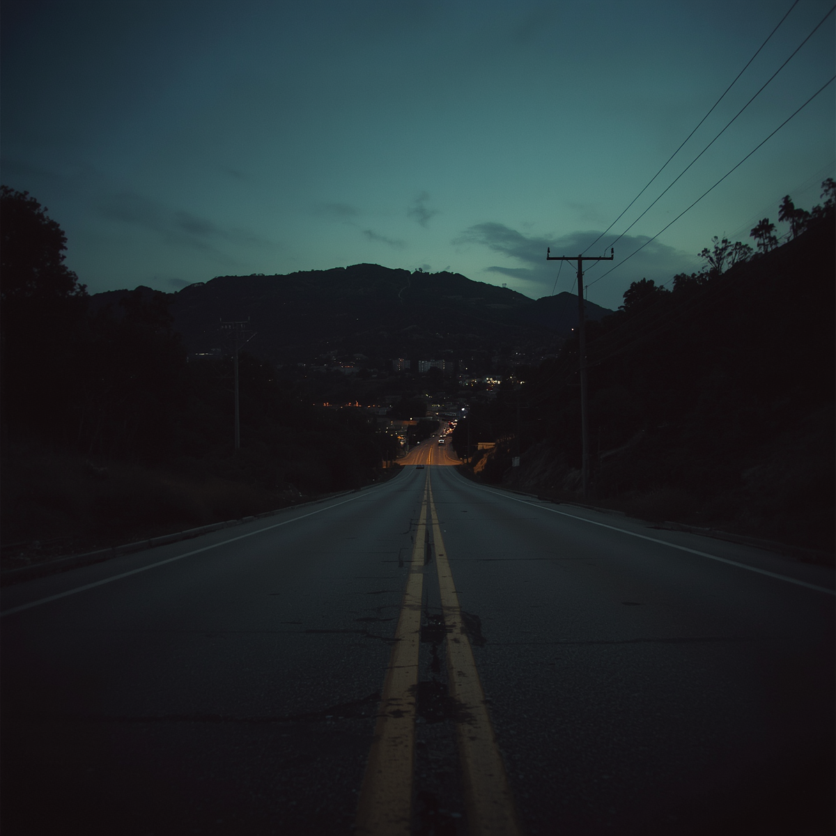 A dark Los Angeles hillside at dusk reflects the uneasy setting behind the Manson Family story.