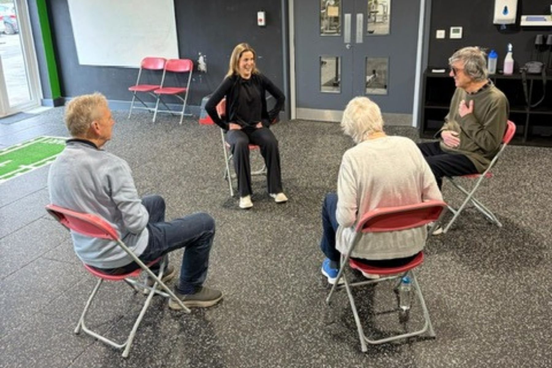 Flic working with her Parkinson's support members