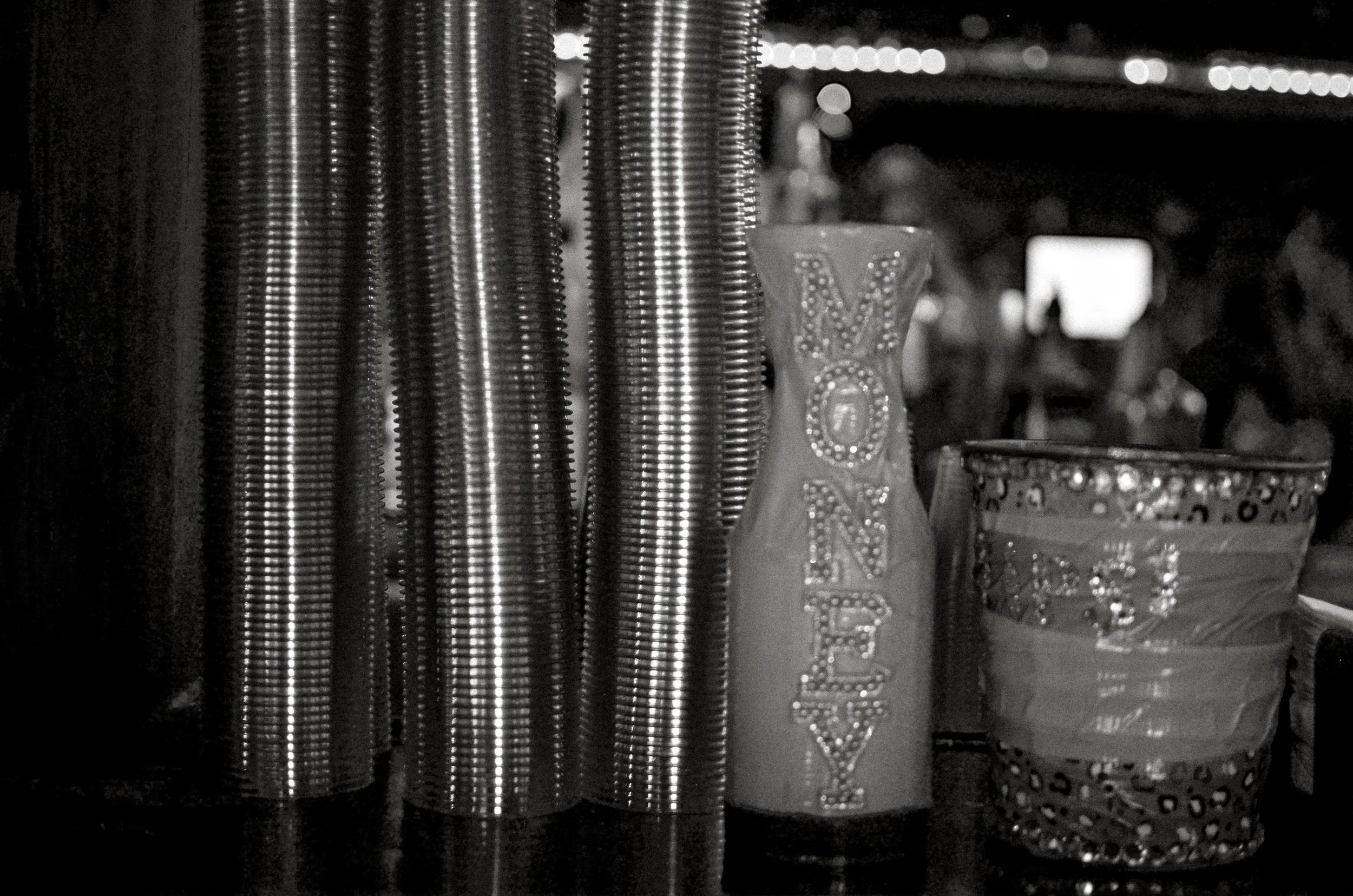 Decorated containers for tips sit on the bar counter. Fort Worth, Texas, USA. 10 August 2023.