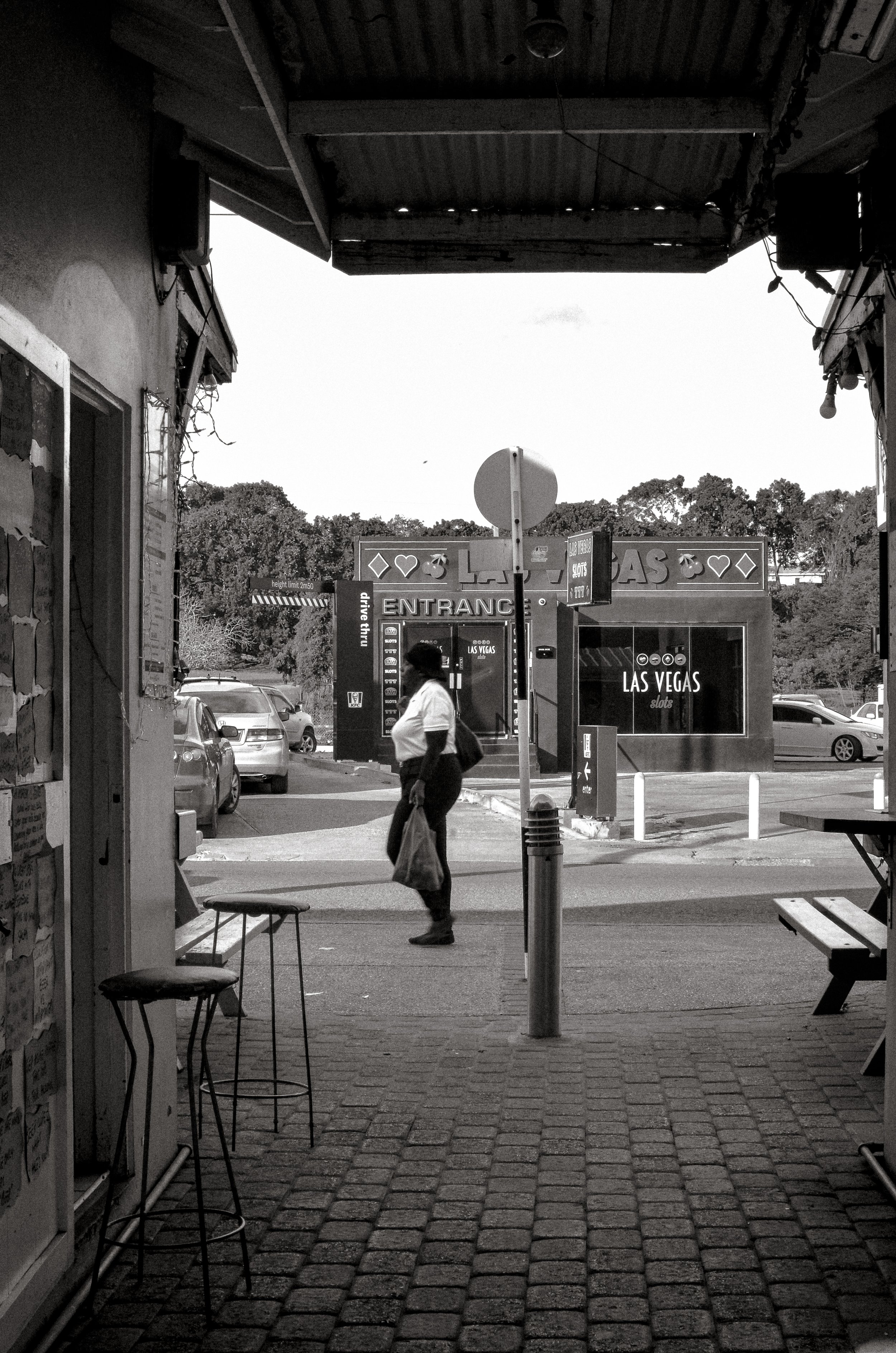 A passage between the market and the evening food stalls. Oistins, Barbados. December 2022.