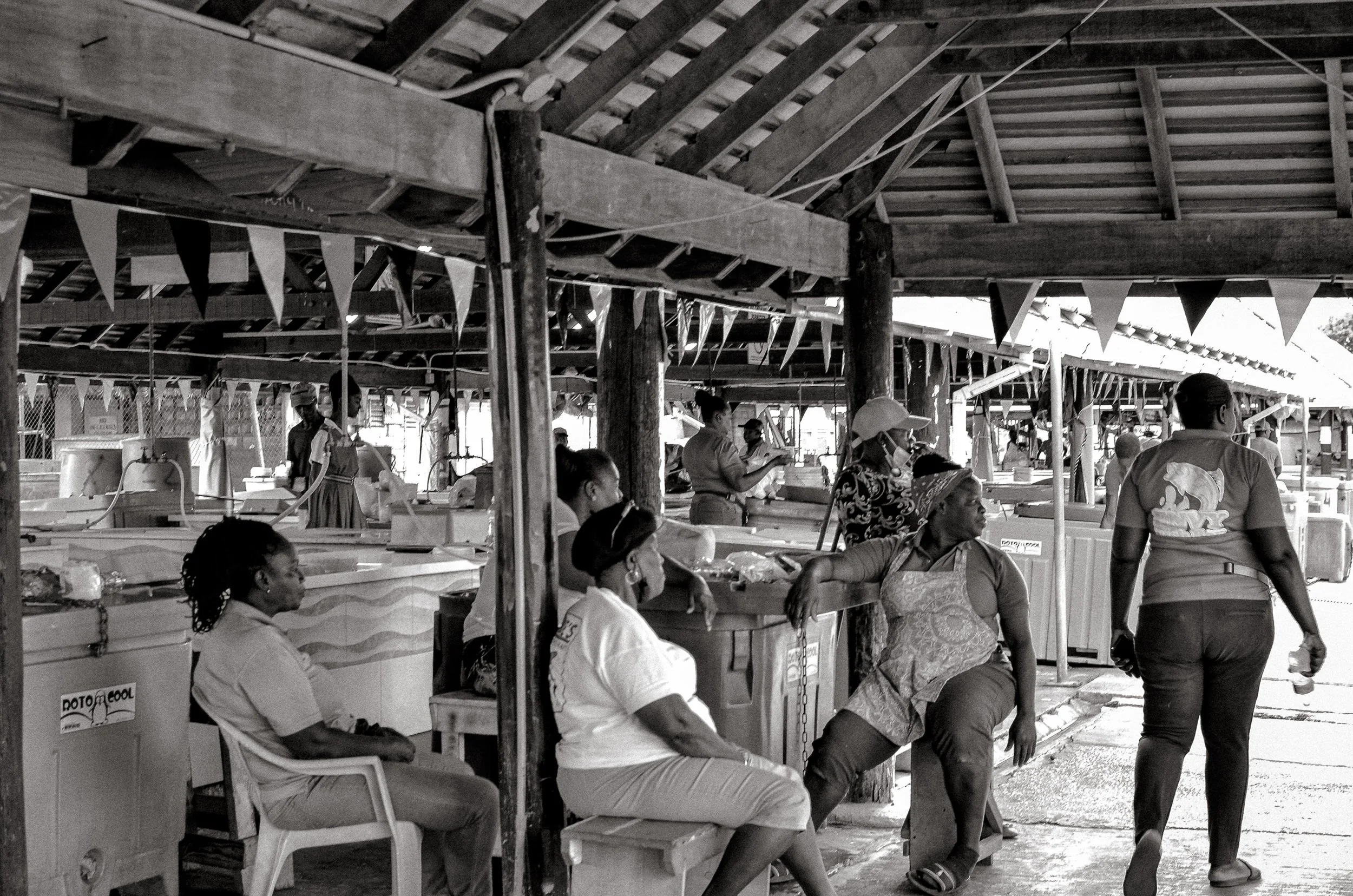 After closing, workers sit together beneath the open roof